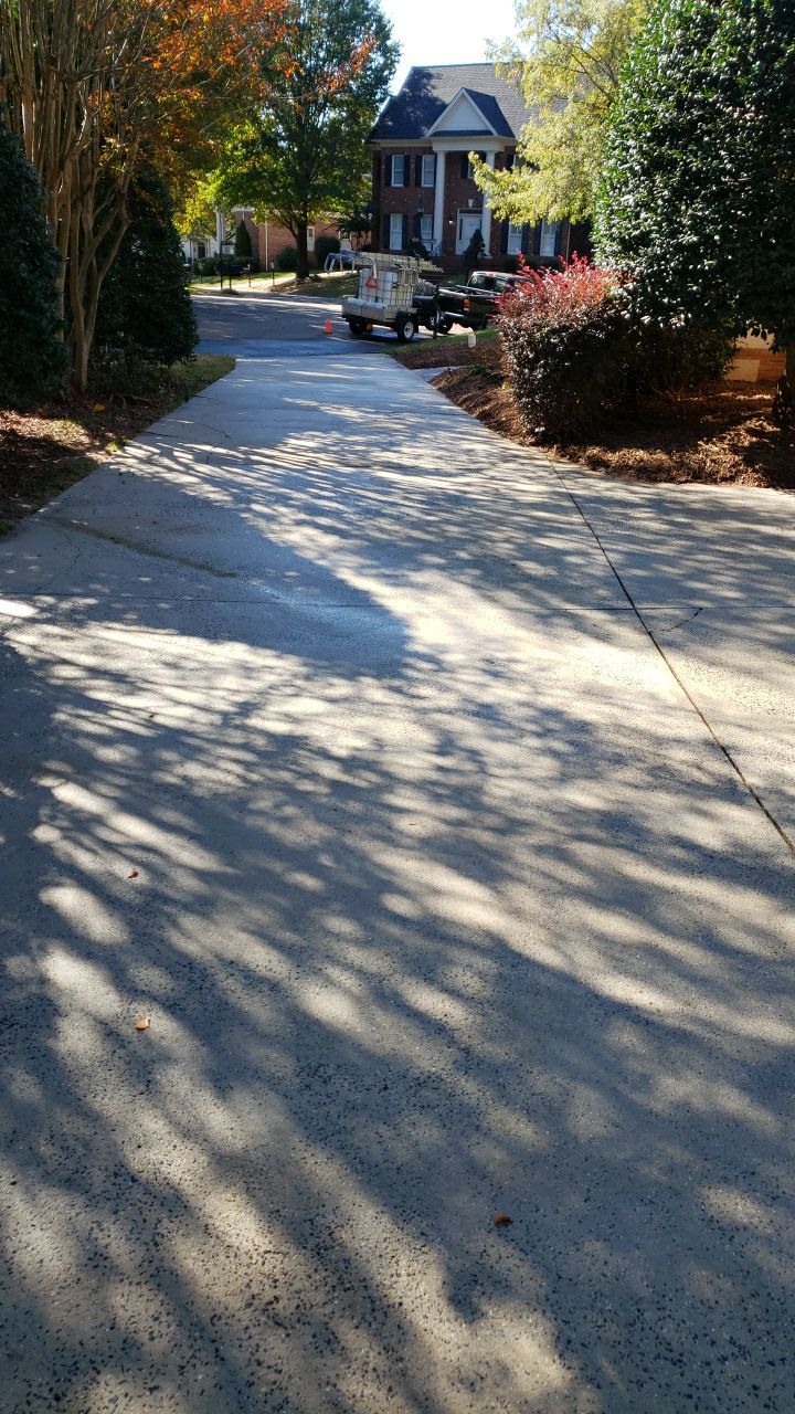 Driveway Clean using cleaner by Power Wash Masters LLC