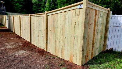 Fence Installation of Capped Wood Privacy Fence
