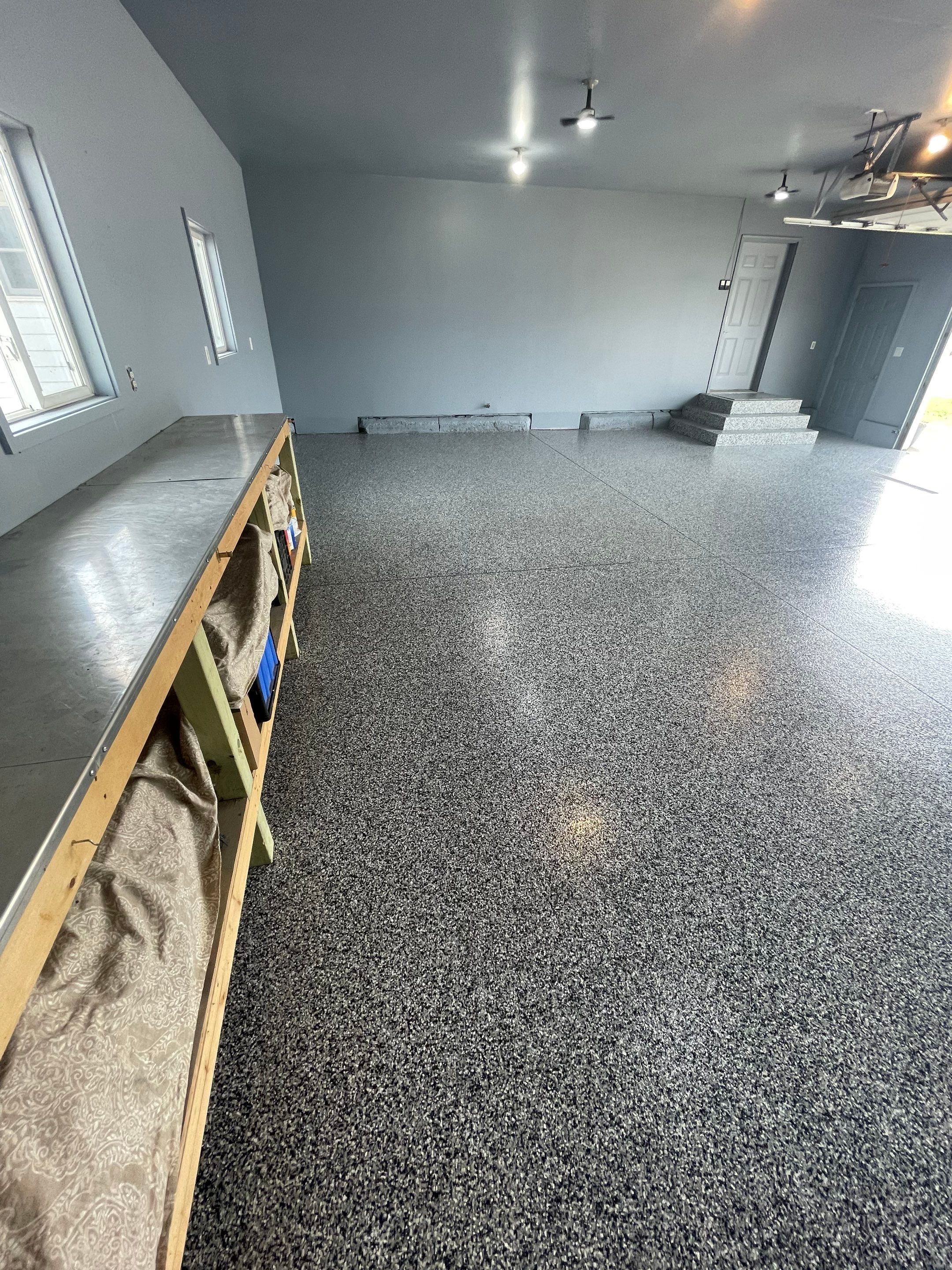 Grey Granite-Style Garage Floor Coating and Stairs in Hartford by Select Painting, Coatings & Garage Cabinets