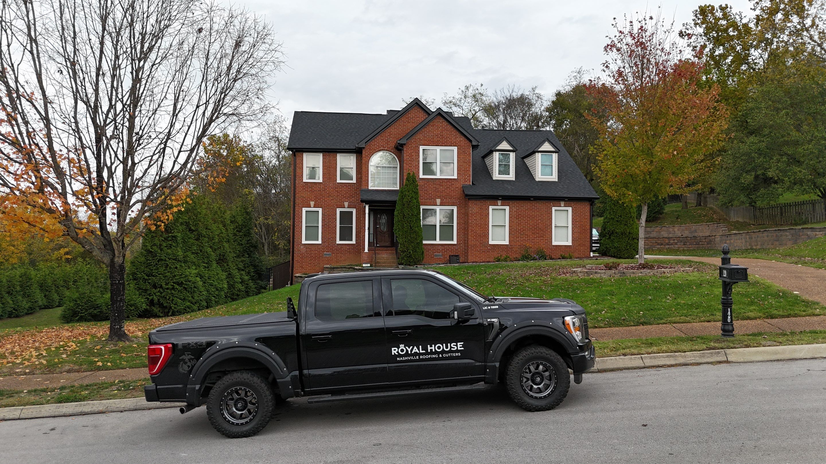 Charcoal Black Re-Roof & Gutters by Royal House LLC