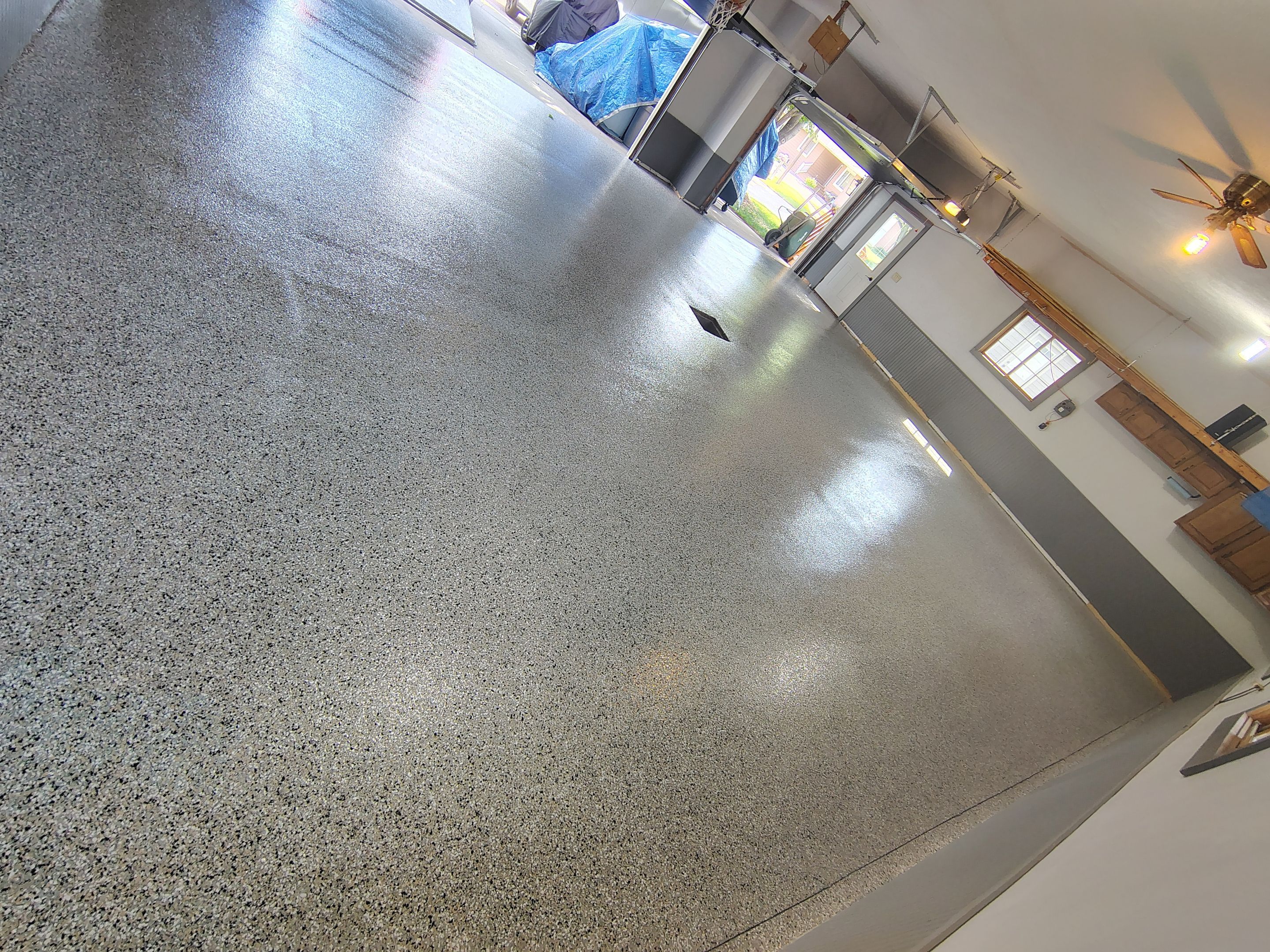 Multi-Fleck Epoxy Garage Floor Coating in Dell Rapids by Select Painting, Coatings & Garage Cabinets
