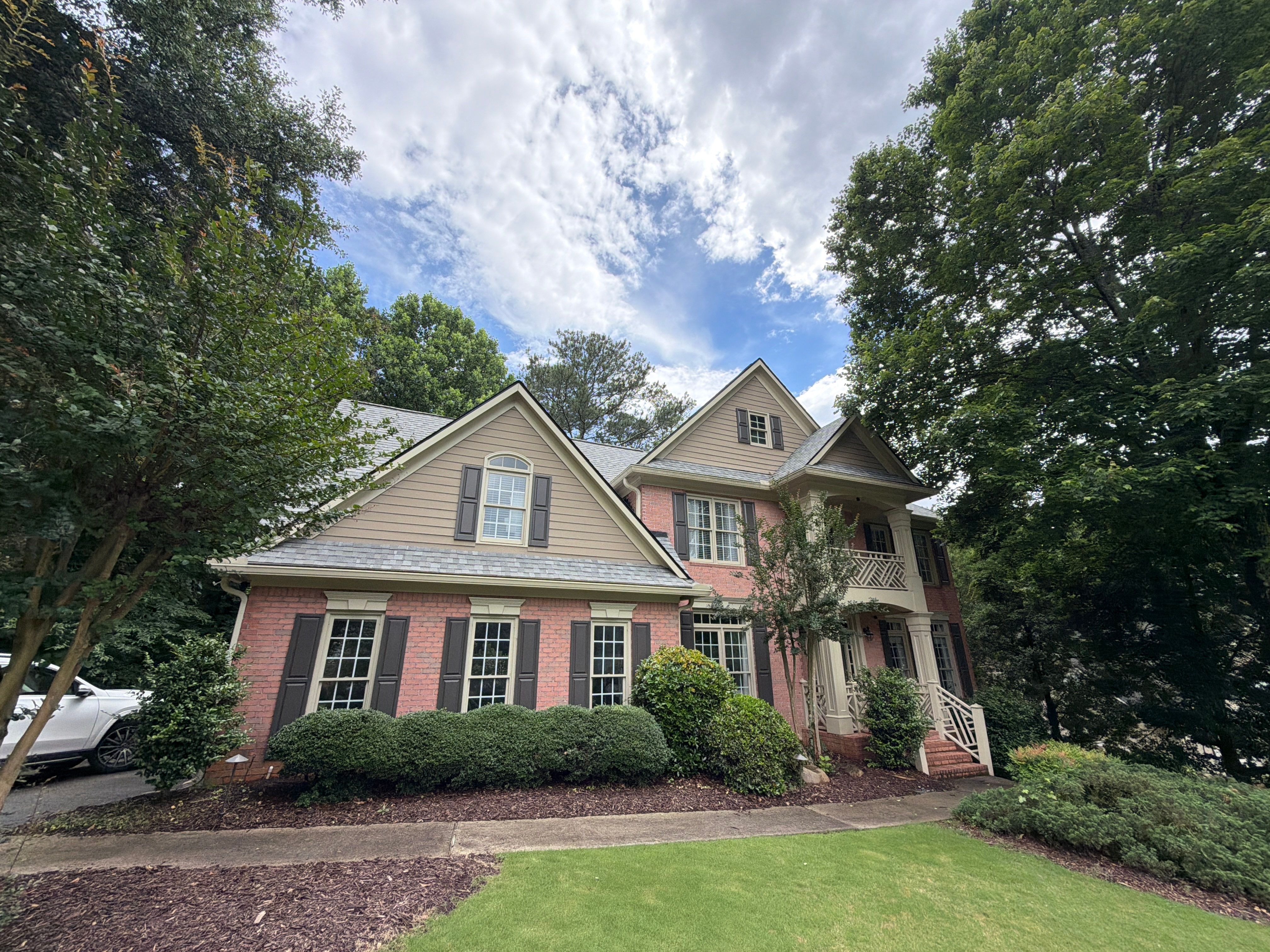 Full James Hardie Siding Replacement and Trex Deck Resurface in the Saddle Color by Nelson Exteriors 