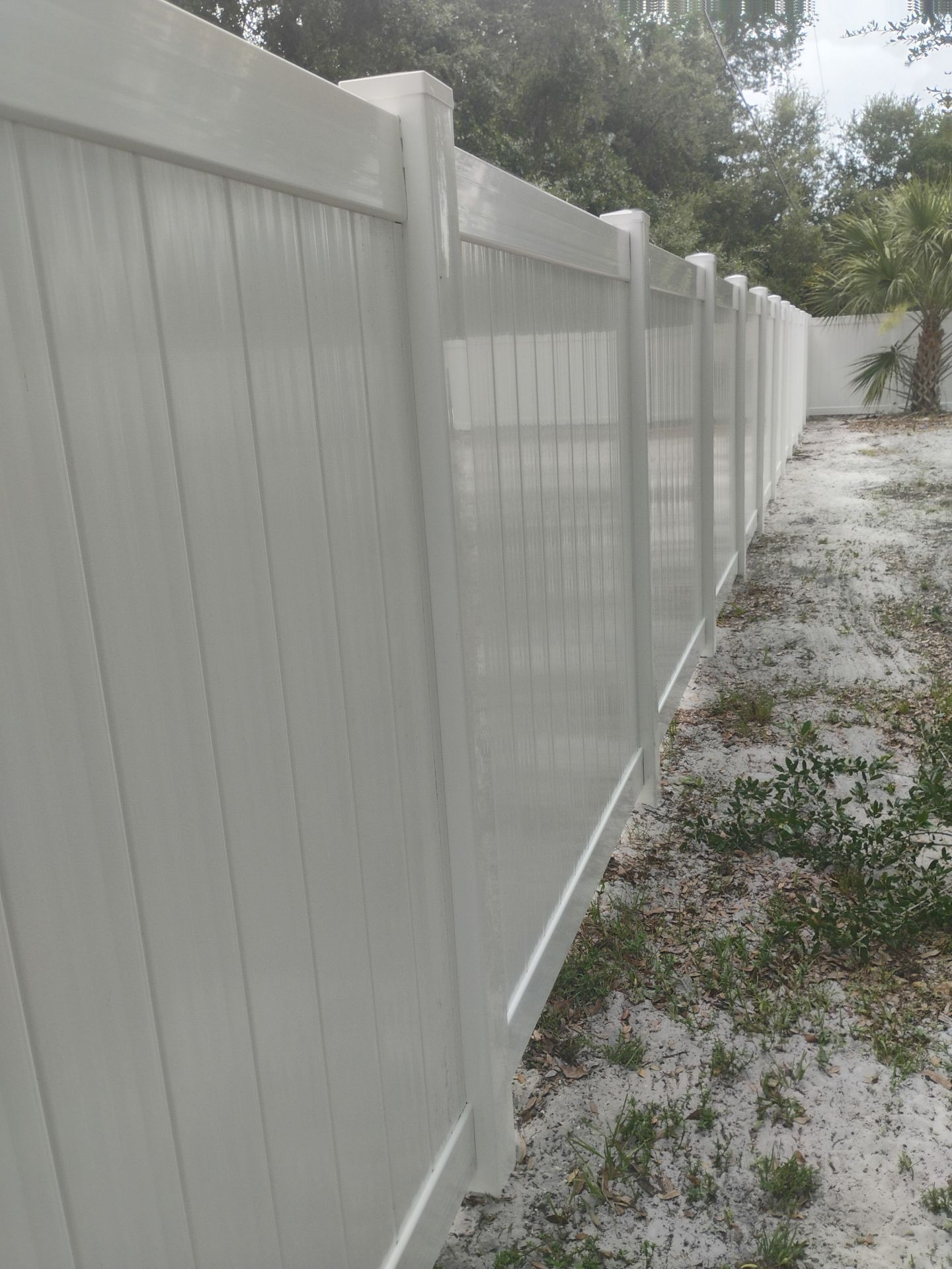 White Vinyl Privacy Fence Installation and Gate Assembly in Punta Gorda by True Fence LLC