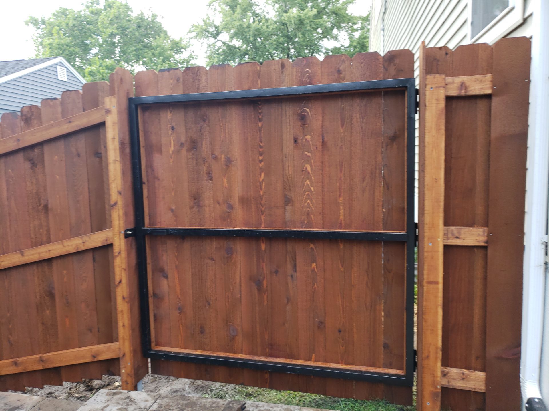 Custom Chestnut Stained Cedar Privacy Fence in Waterloo by Perfect Picket Fence and Stain