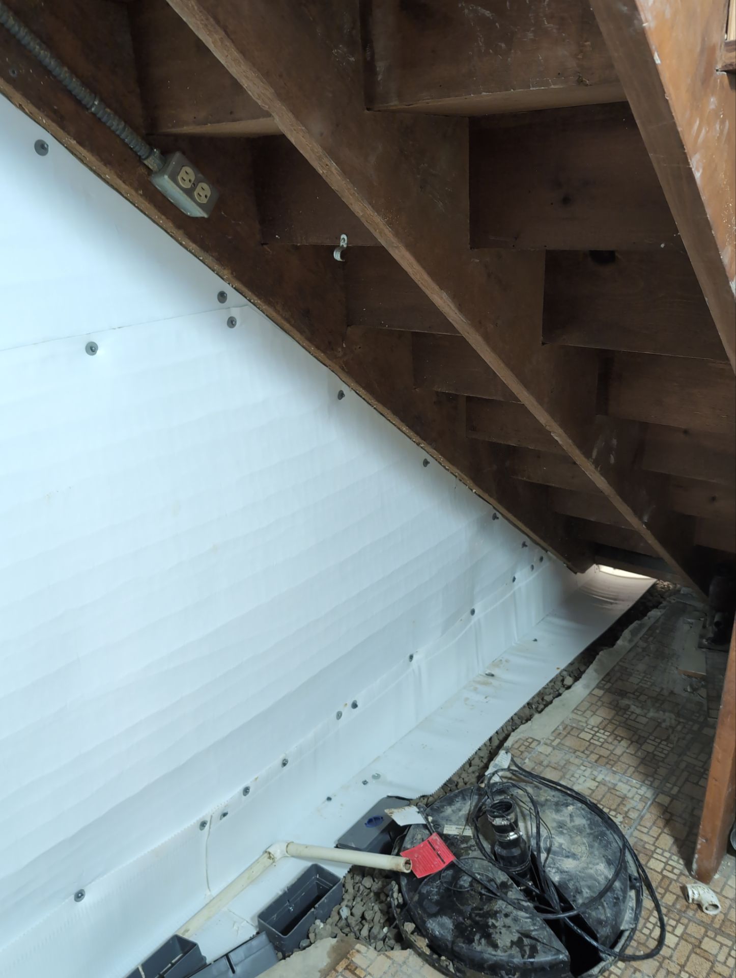 Interior Basement Waterproofing System and Egress Window Installation by Toledo Basement Repair 