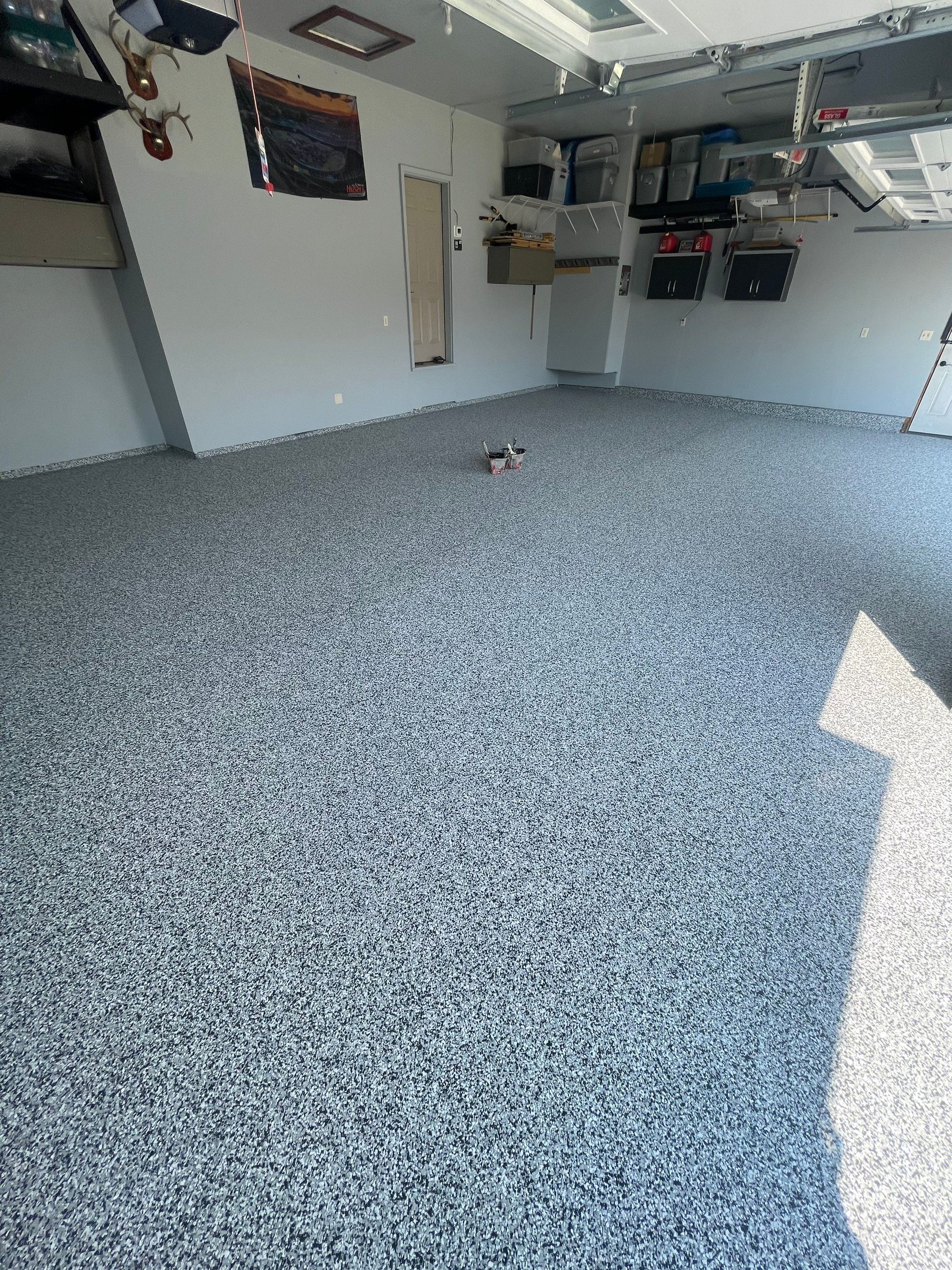 Sioux Falls Garage Concrete Coating Installation with Domino Flake by Select Painting, Coatings & Garage Cabinets