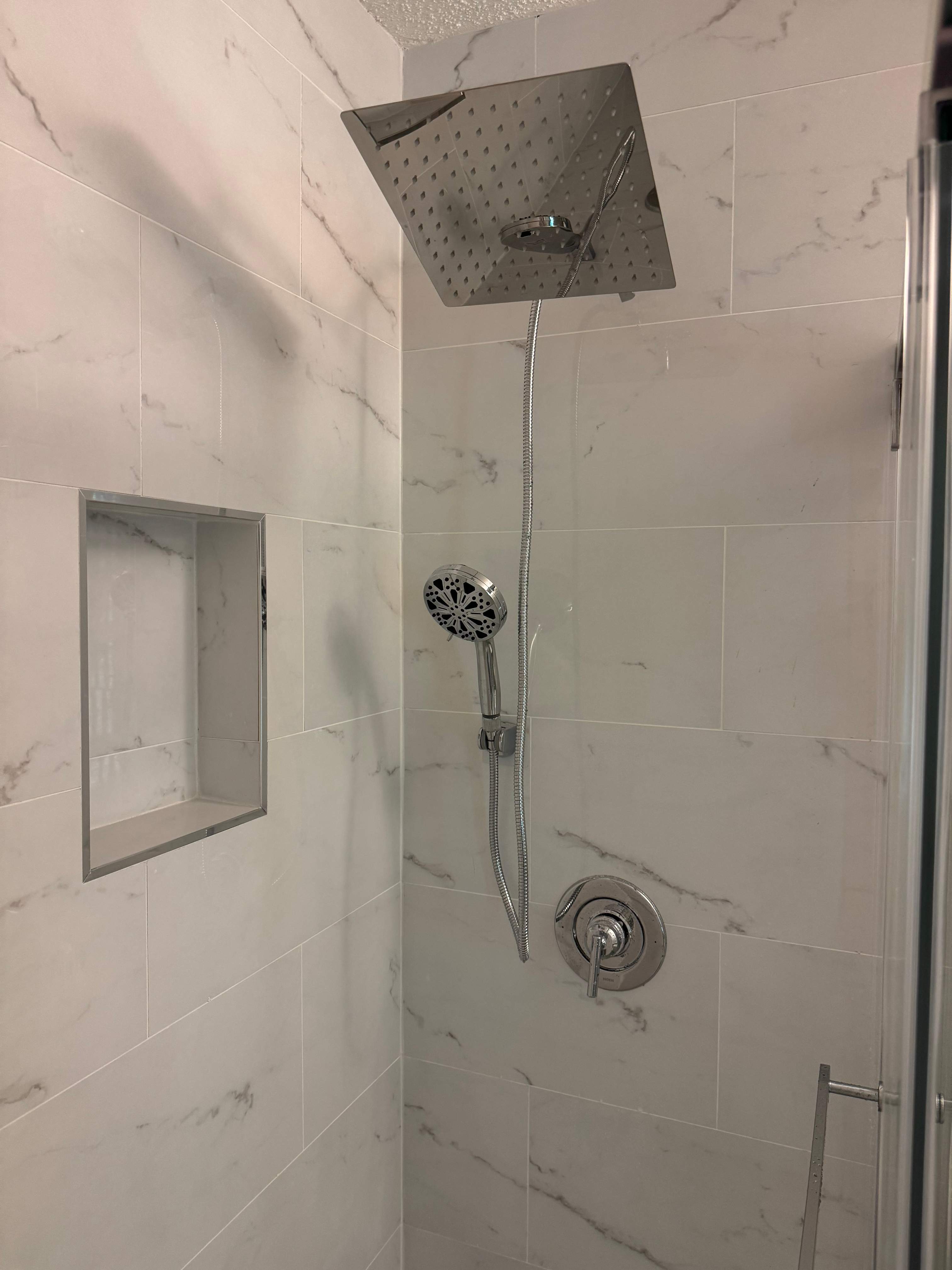 Tub to walk-in shower conversion by Prudencio