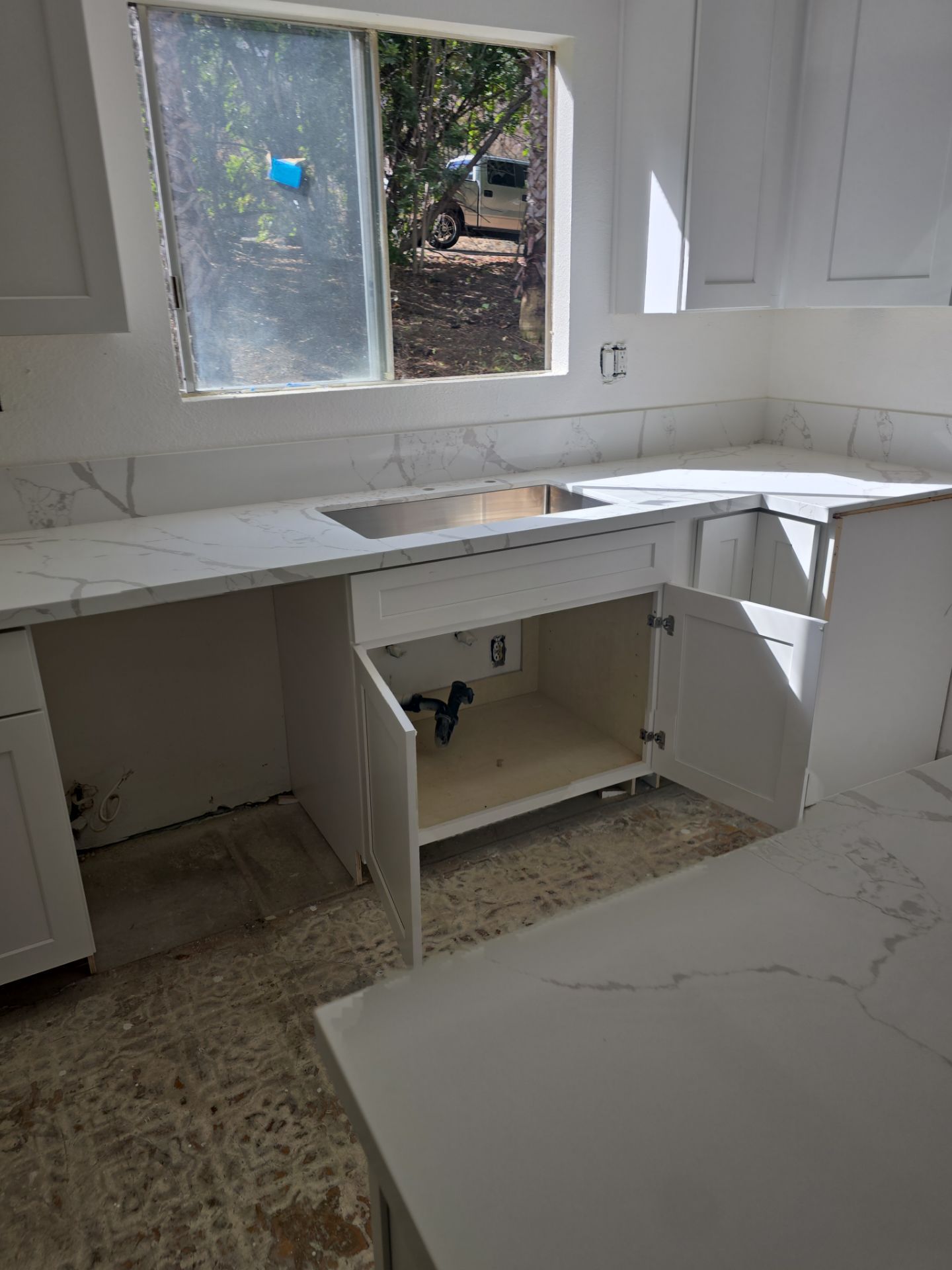 Scope of Work: Installation of Shower, Toilet, Plumbing, Kitchen Sink, and Fixtures by Us Plumbing 