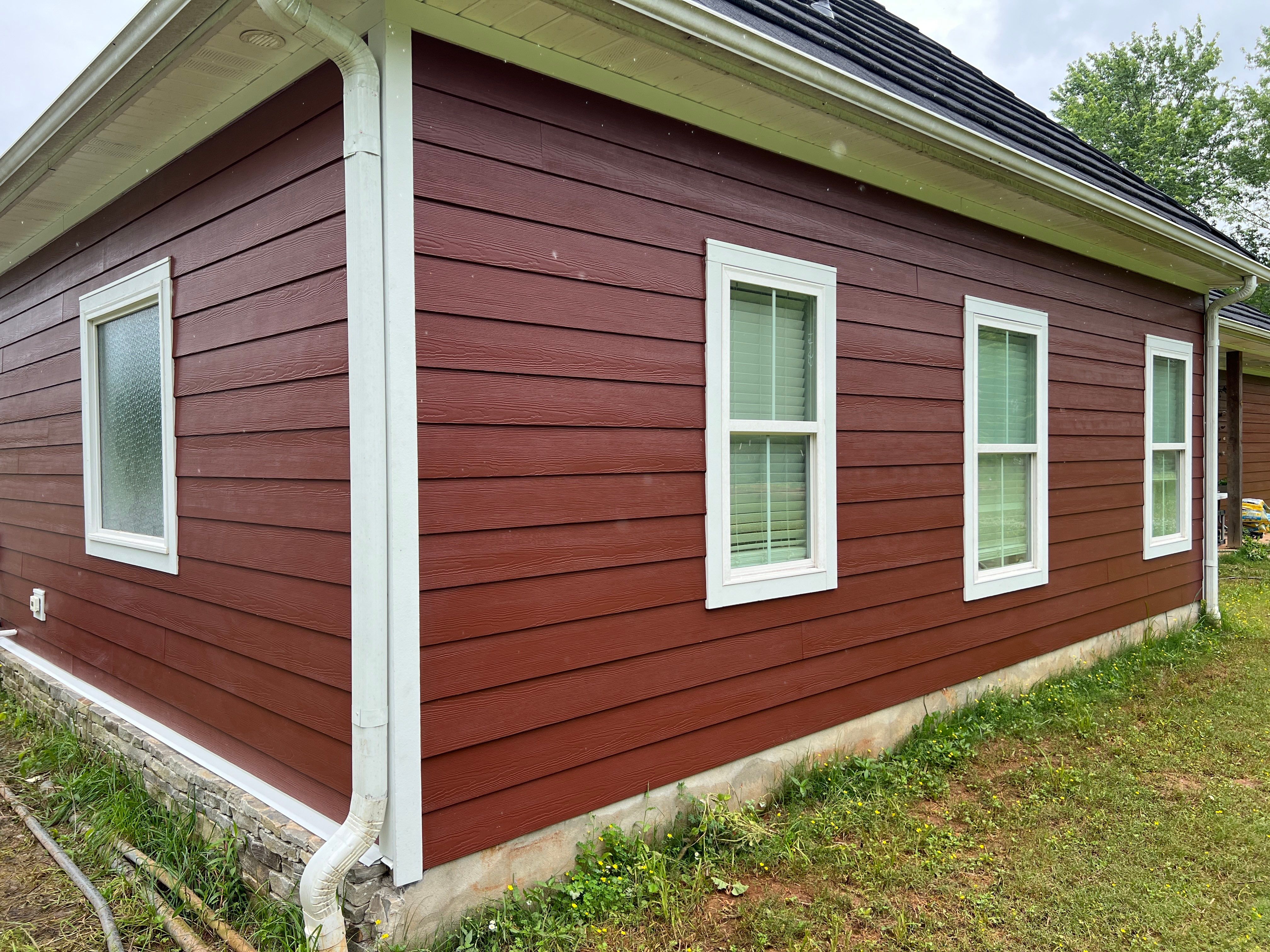 Siding Replacement using James Hardie Countrylane Red by Freedom Exteriors