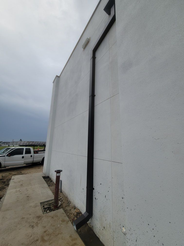 Downspout Installation using collector head in Cape Coral FL by Gutter Professors