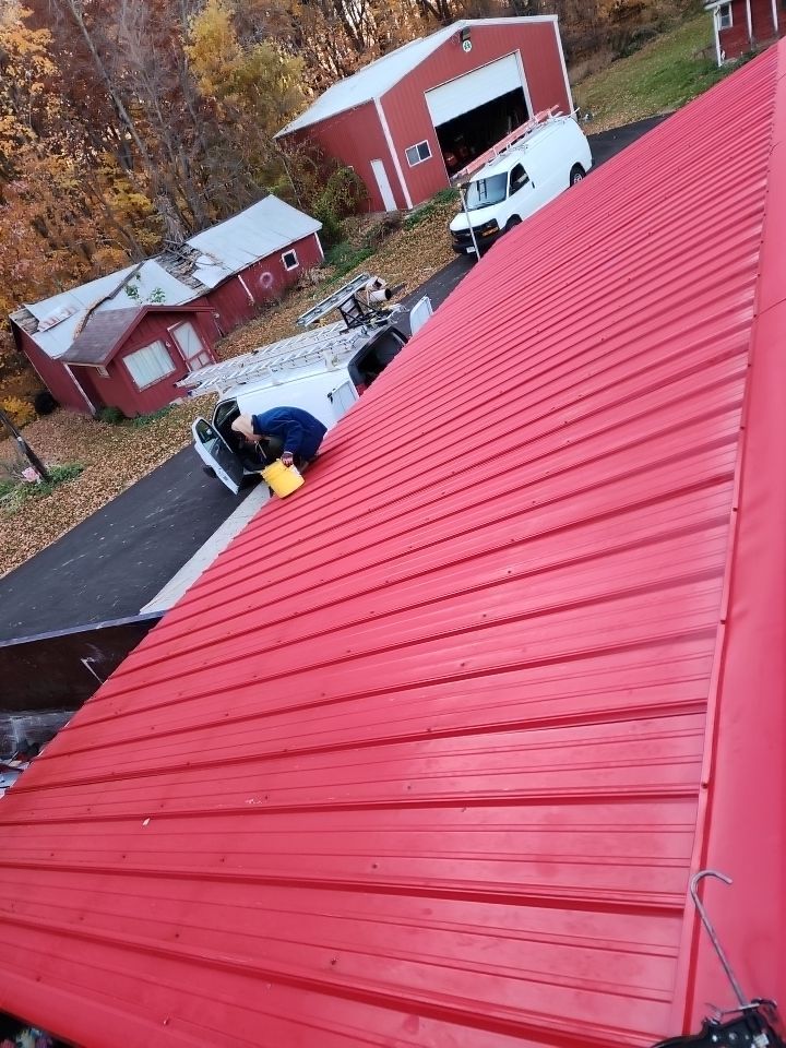 Residential Roof Installation with Red Pro Rib Metal Roofing in Adell, WI by Gellings Roofing and Siding LLC