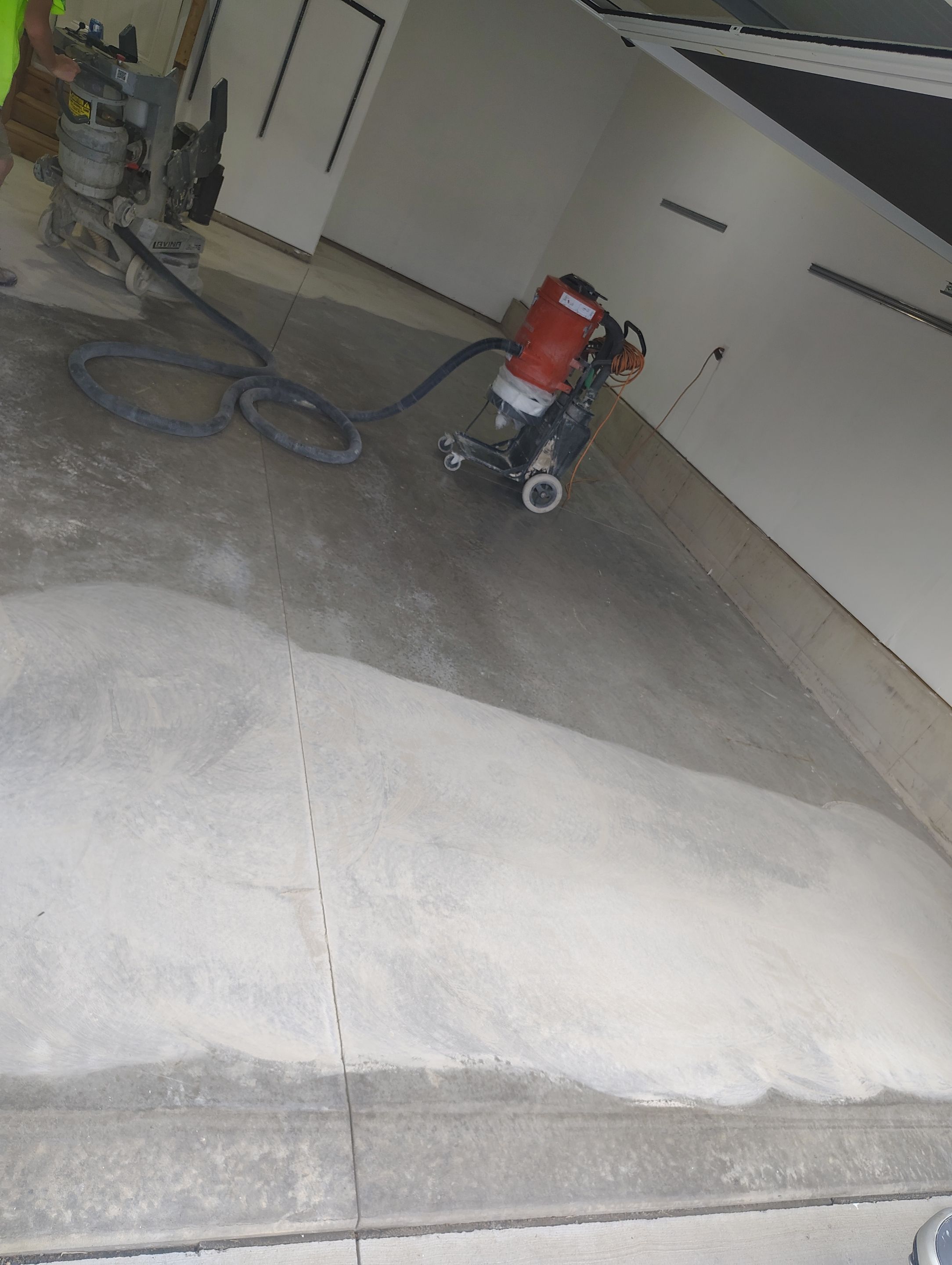 Sioux Falls Garage Floor Transformation With Gray Speckled Epoxy Coating by Select Painting, Coatings & Garage Cabinets