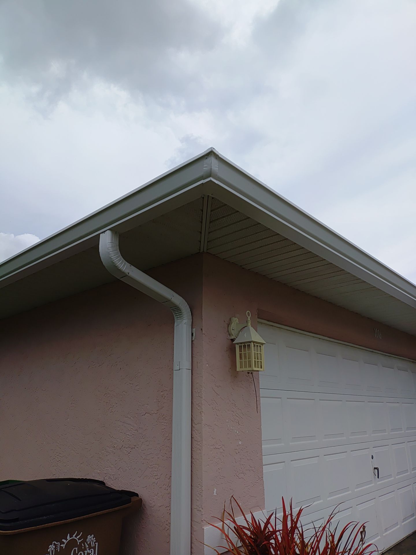 Replace gutter using White Down Spouts in Cape Coral FL by Gutter Professors