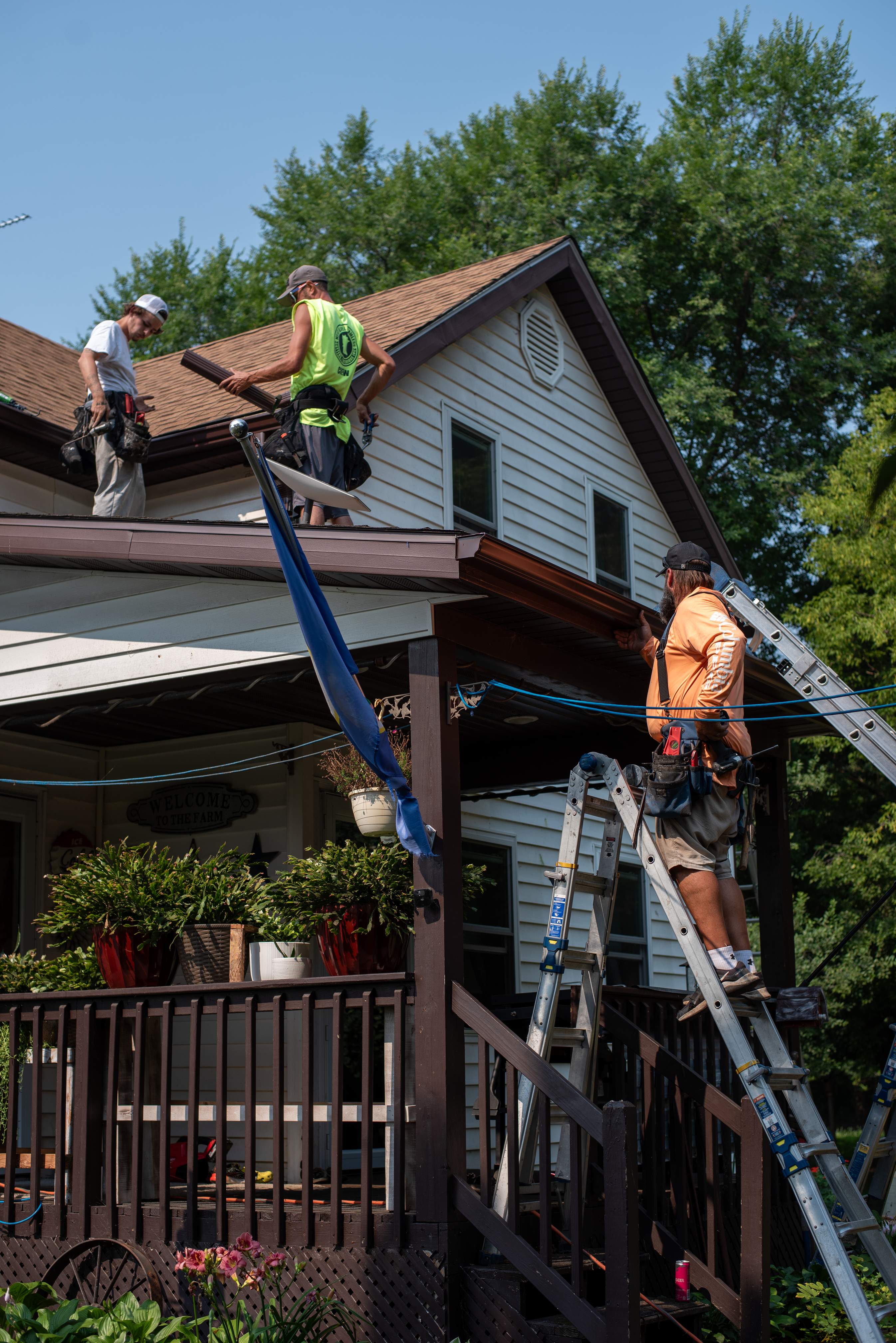 Royal Granite Siding Replacement & Brown Seamless Gutters by Next Level Seamless Gutters / Exteriors Inc.