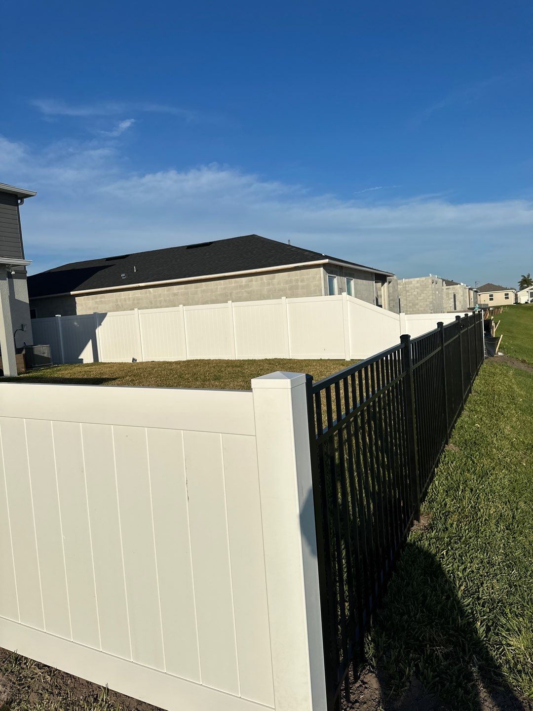 Vinyl Fence Installation using Black 3 Rail Aluminum and Vinyl Privacy Fence  by Asap fence and gates, LLC