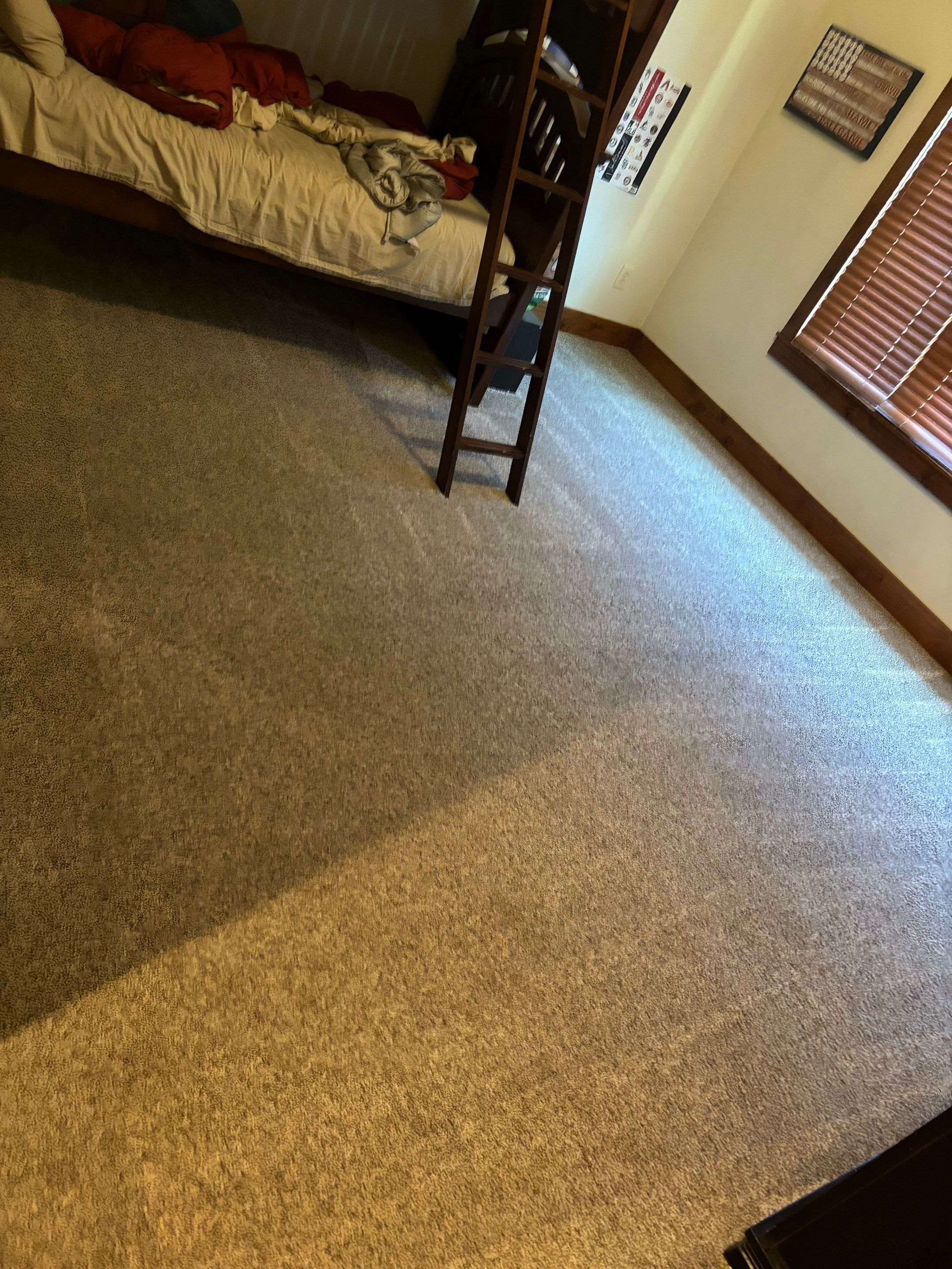 the service being done is carpet cleaning in a bedroom ensuring a fresh and clean living space