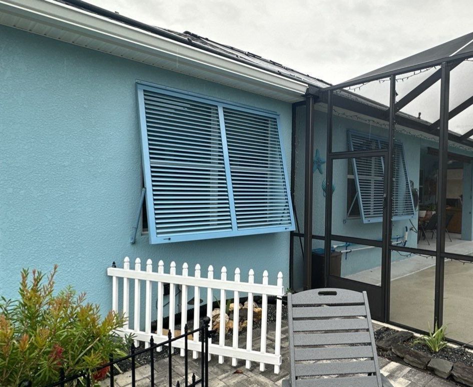 Hurricane Rated Shutters in Pastel Blue by Smart Guard Shutters