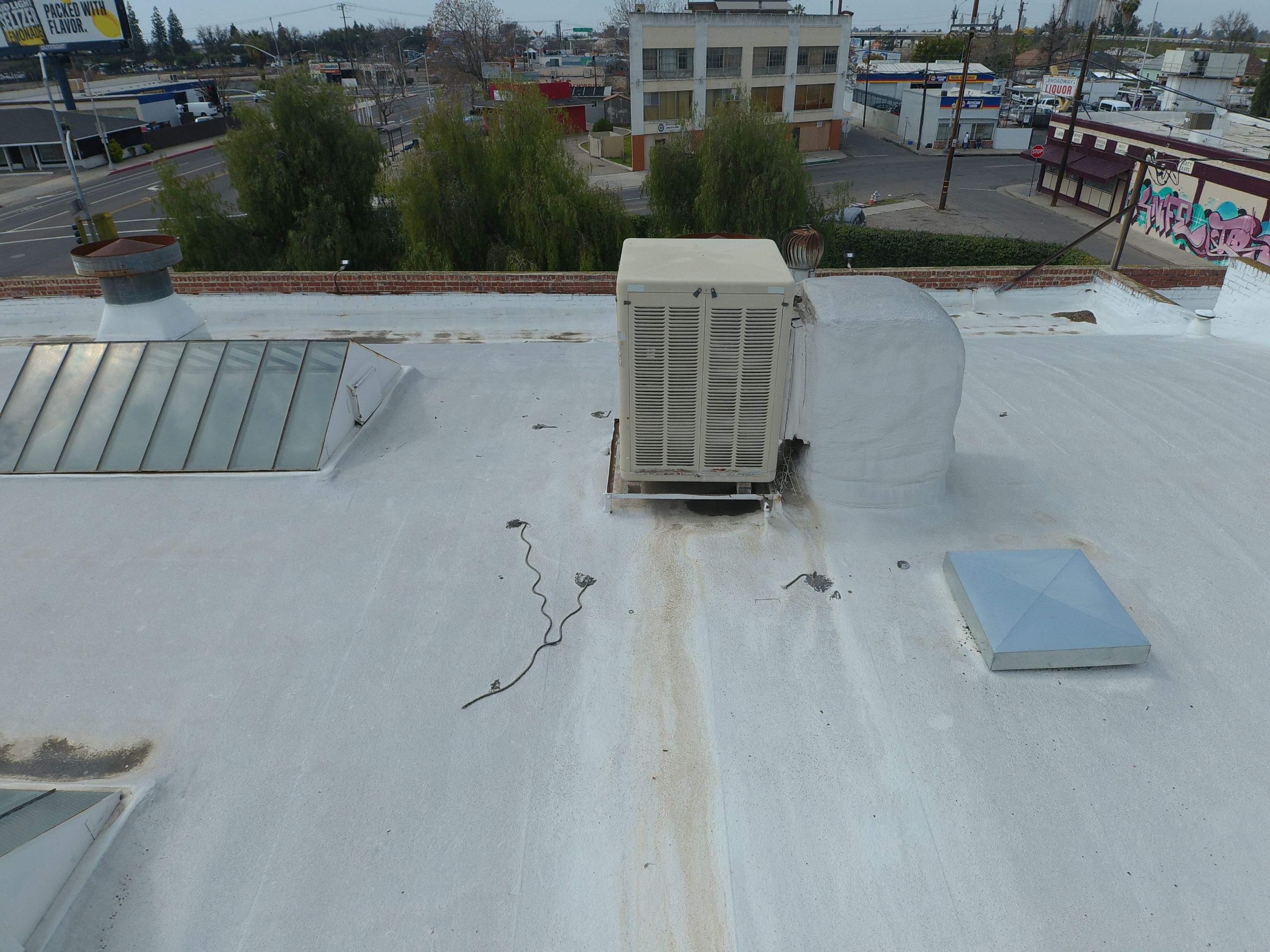 Polyurethane foam roof refurbish and recoating by Straight Edge Roofing Inc