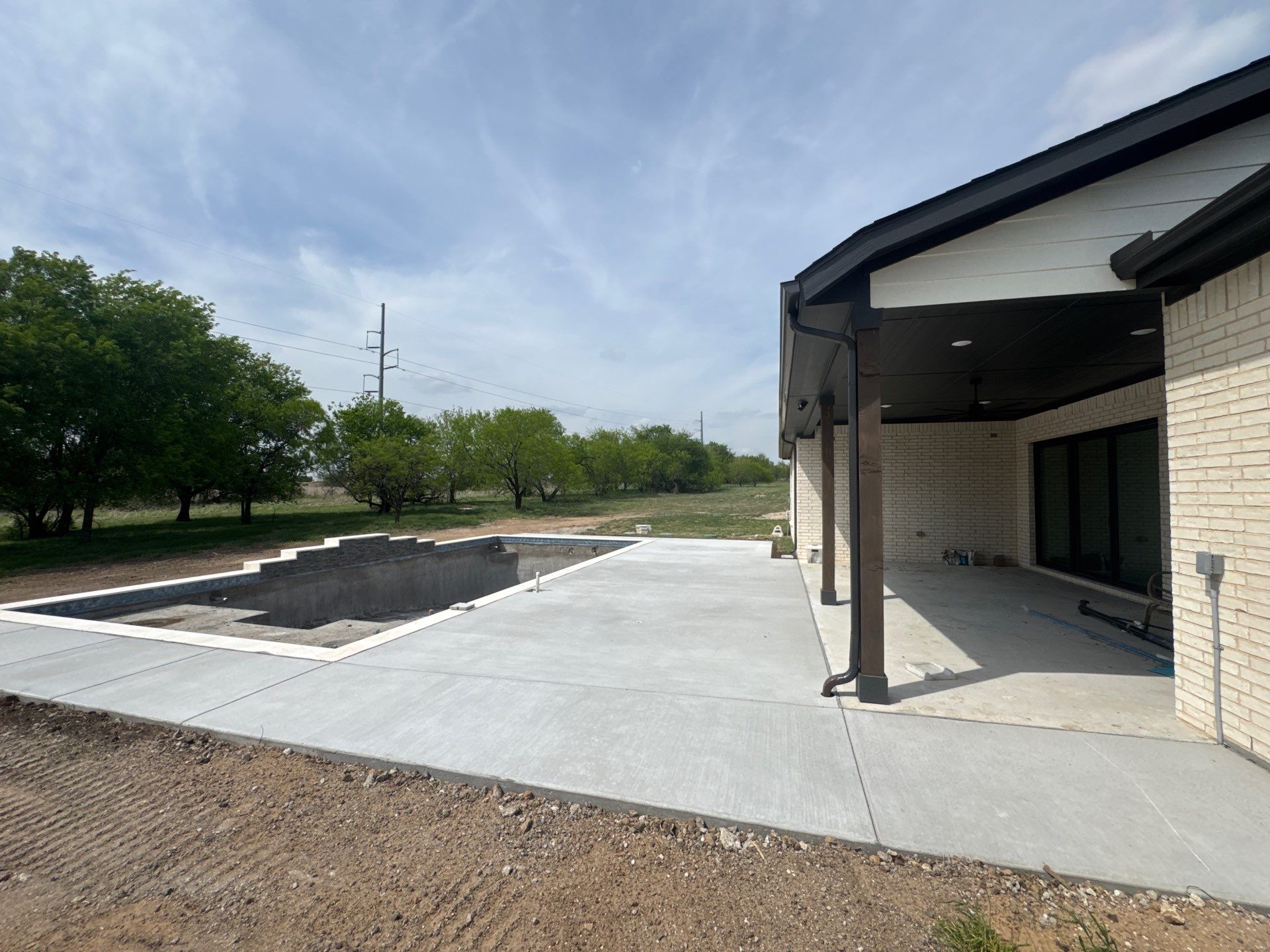 Expansive Geometric Pool with Countryside Views by Pinnacle Pools and Spas - DFW