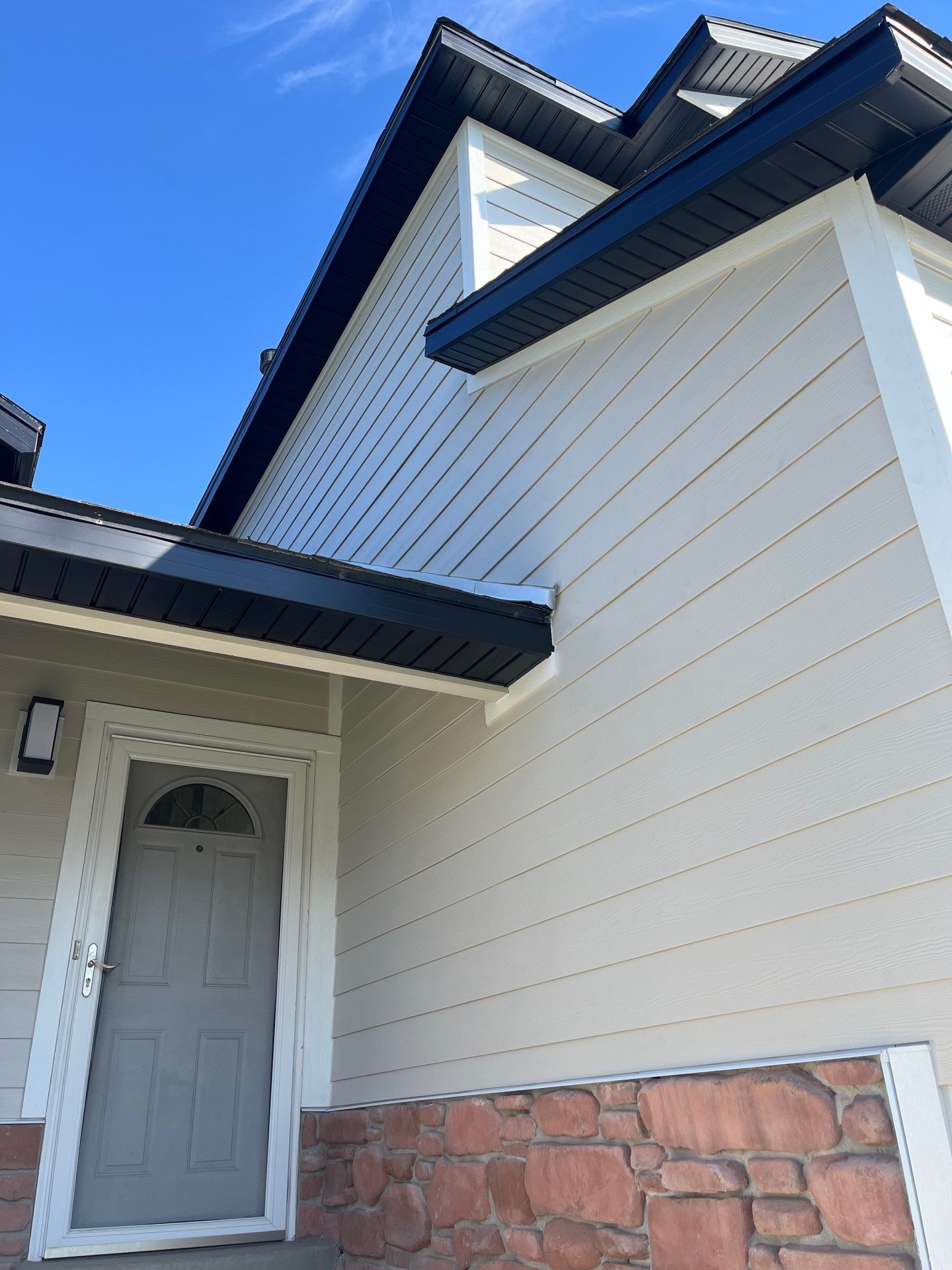 Farmington | Stucco/Vinyl Demo & Hardie Conversion | Cobble Stone & Black by Ideal Siding Utah