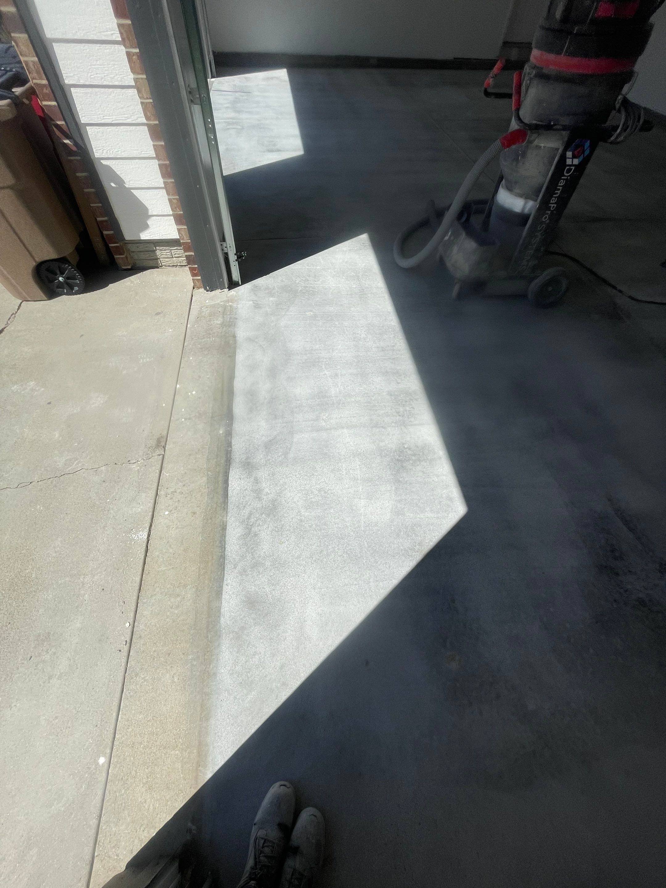 Tidal Wave Flake Garage Floor Installation in Sioux Falls by Select Painting, Coatings & Garage Cabinets