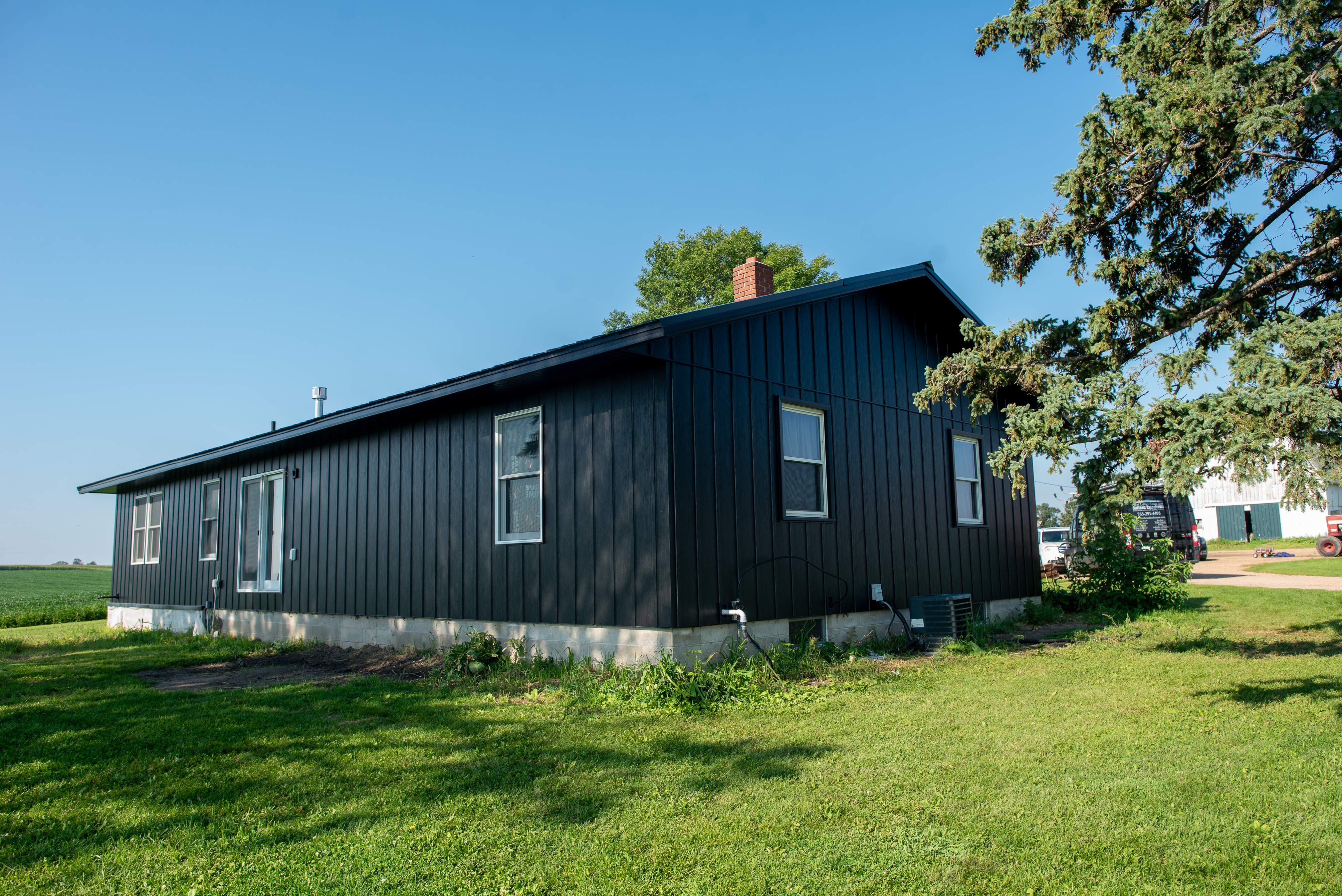 EDCO Steel Siding with Black Fascia & Soffit – Waverly, MN by Next Level Seamless Gutters / Exteriors Inc.