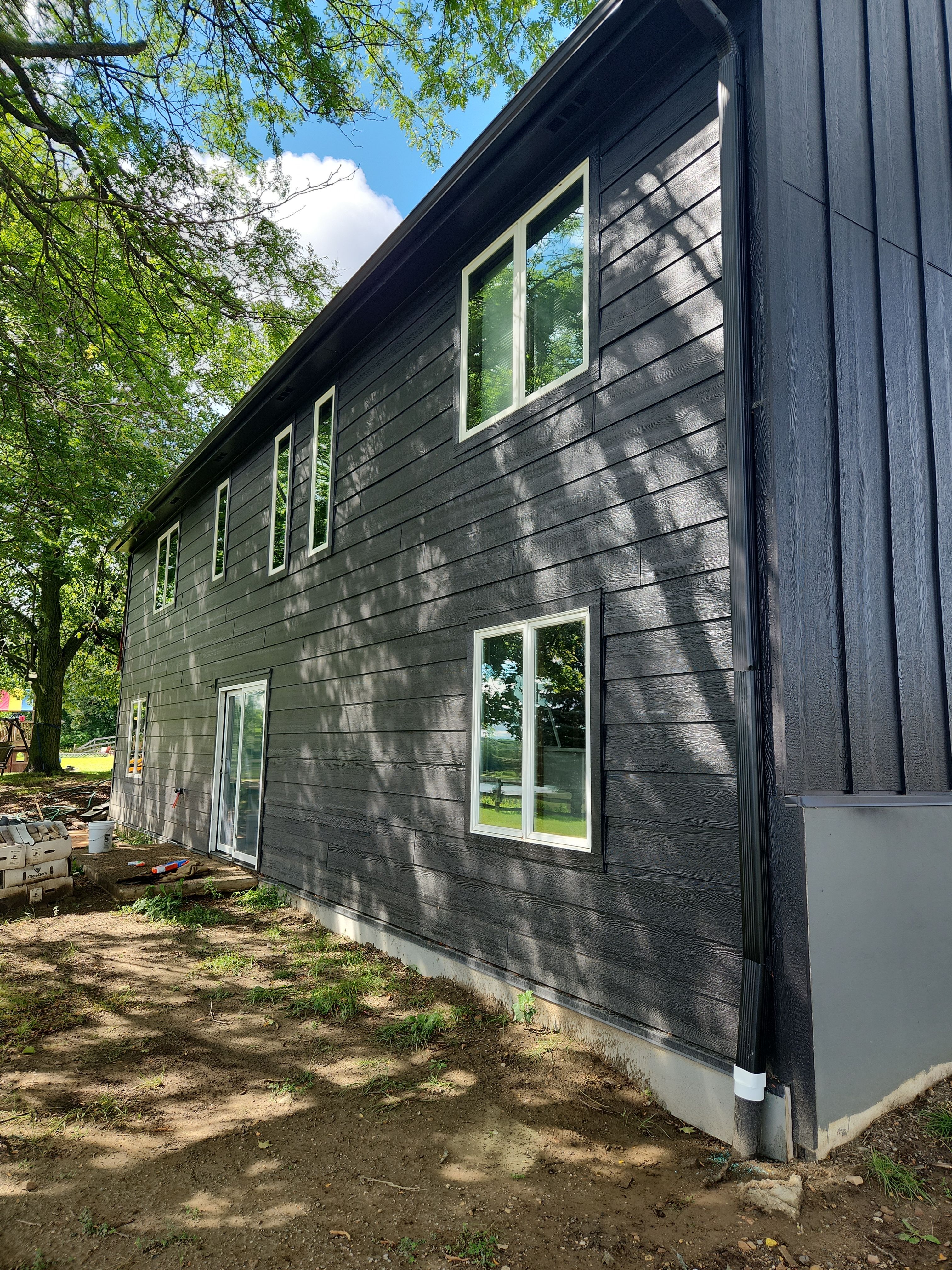 Black Seamless Gutters in Buffalo, MN by Next Level Seamless Gutters / Exteriors Inc.