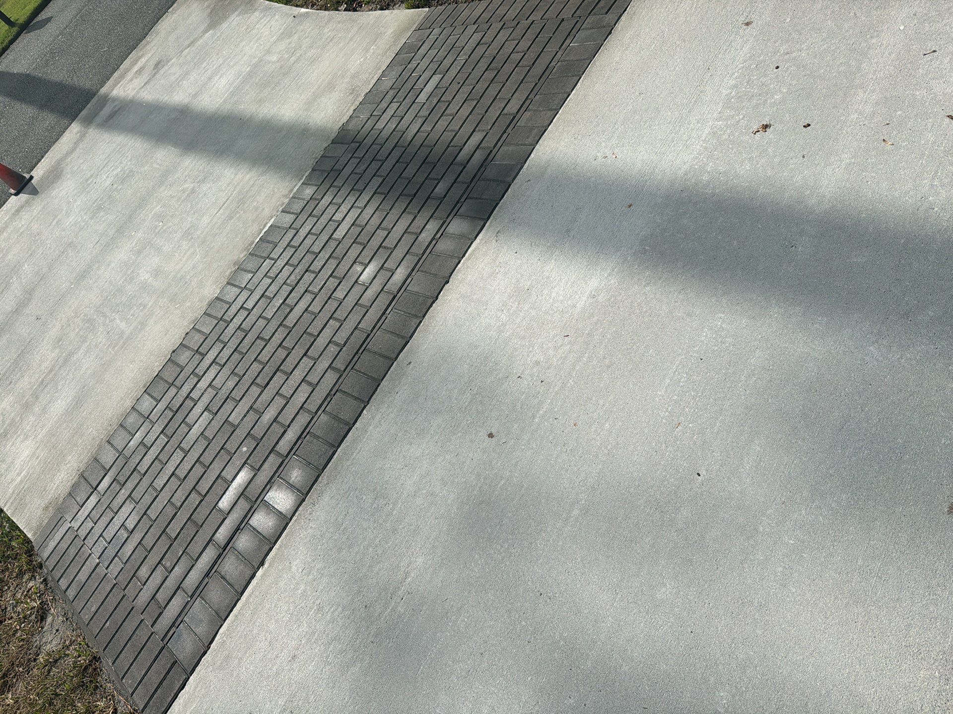 Concrete Driveway Replacement with Decorative Paver Inlay in Hilton Head Island by Lowcountry Scapes, LLC