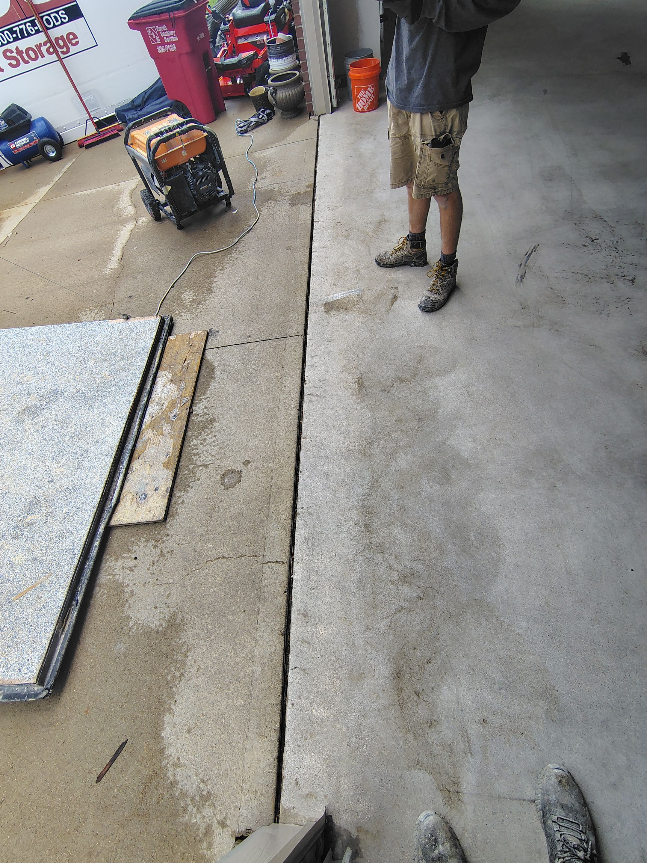 Sioux Falls Garage Concrete Grinding and Nightfall Decorative Chip Coating by Select Painting, Coatings & Garage Cabinets