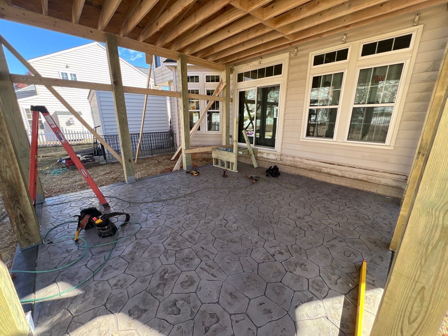 Custom Screened-In Porch with Stamped Concrete Patio in Warrenton by Jakari Restoration & Construction LLC