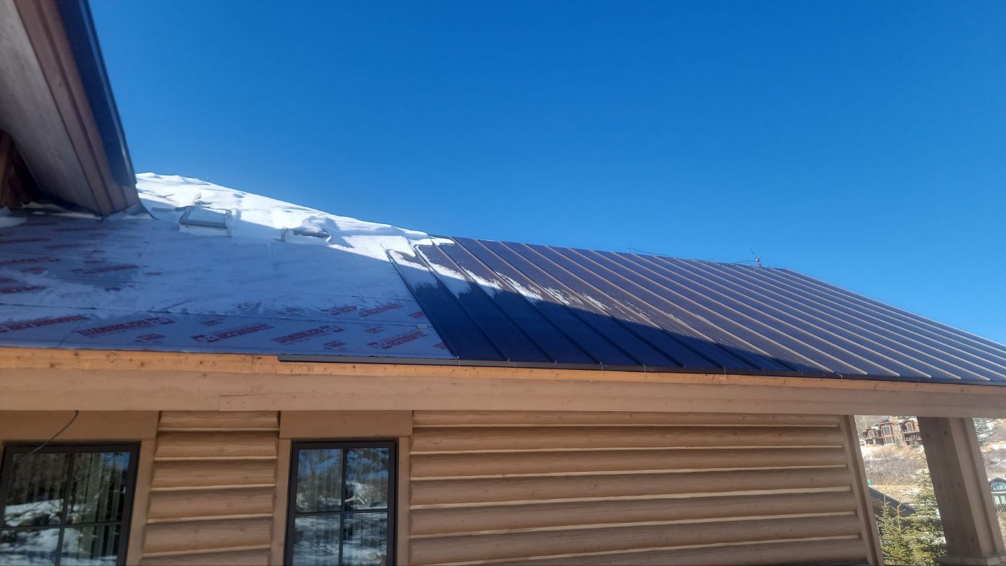 Standing Seam Metal Roof Replacement After Snow Damage by ASAP Roofing & Restoration