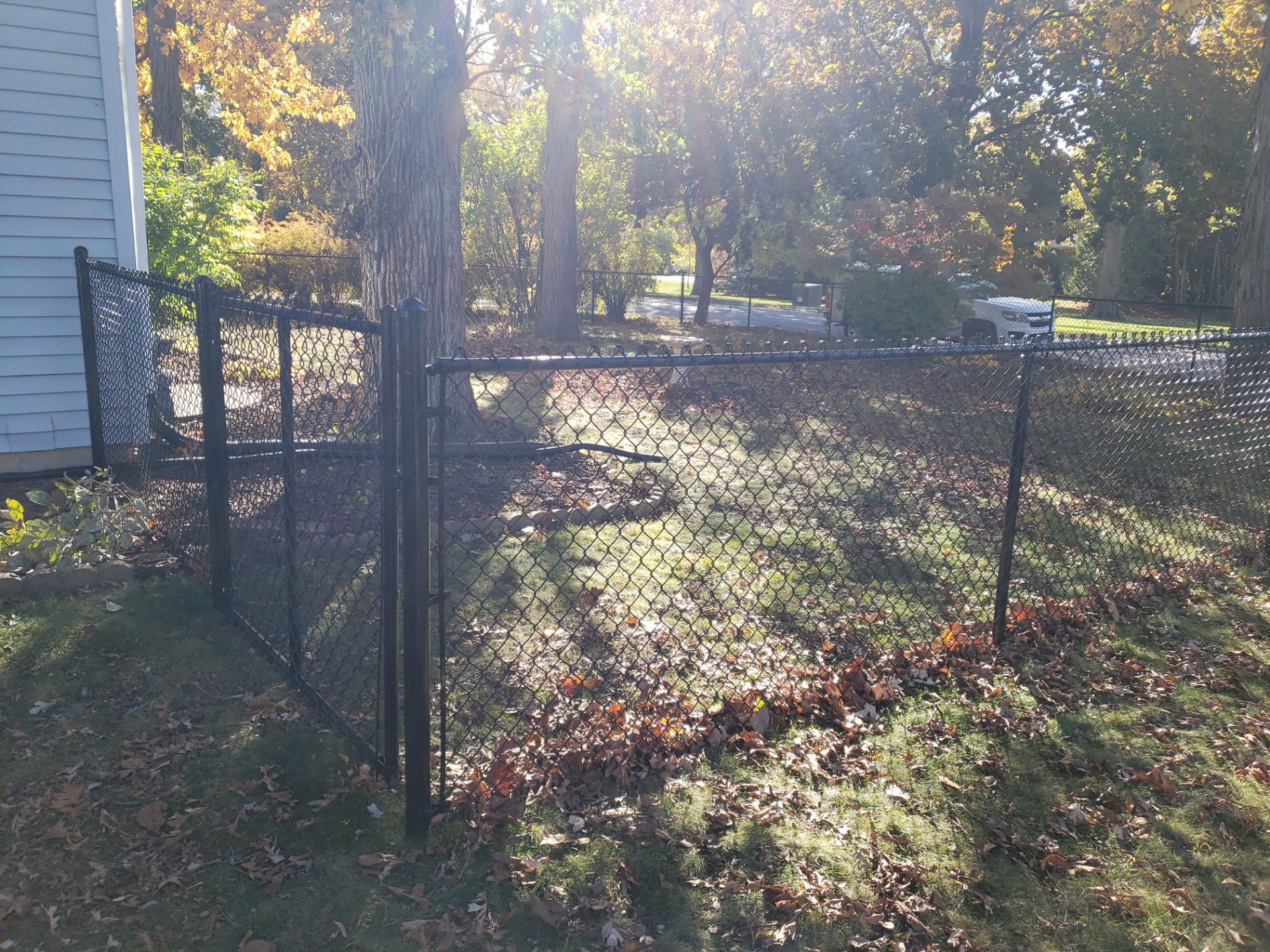 Black Chain Link Fence Installation in Cedar Falls, Iowa by Perfect Picket Fence and Stain