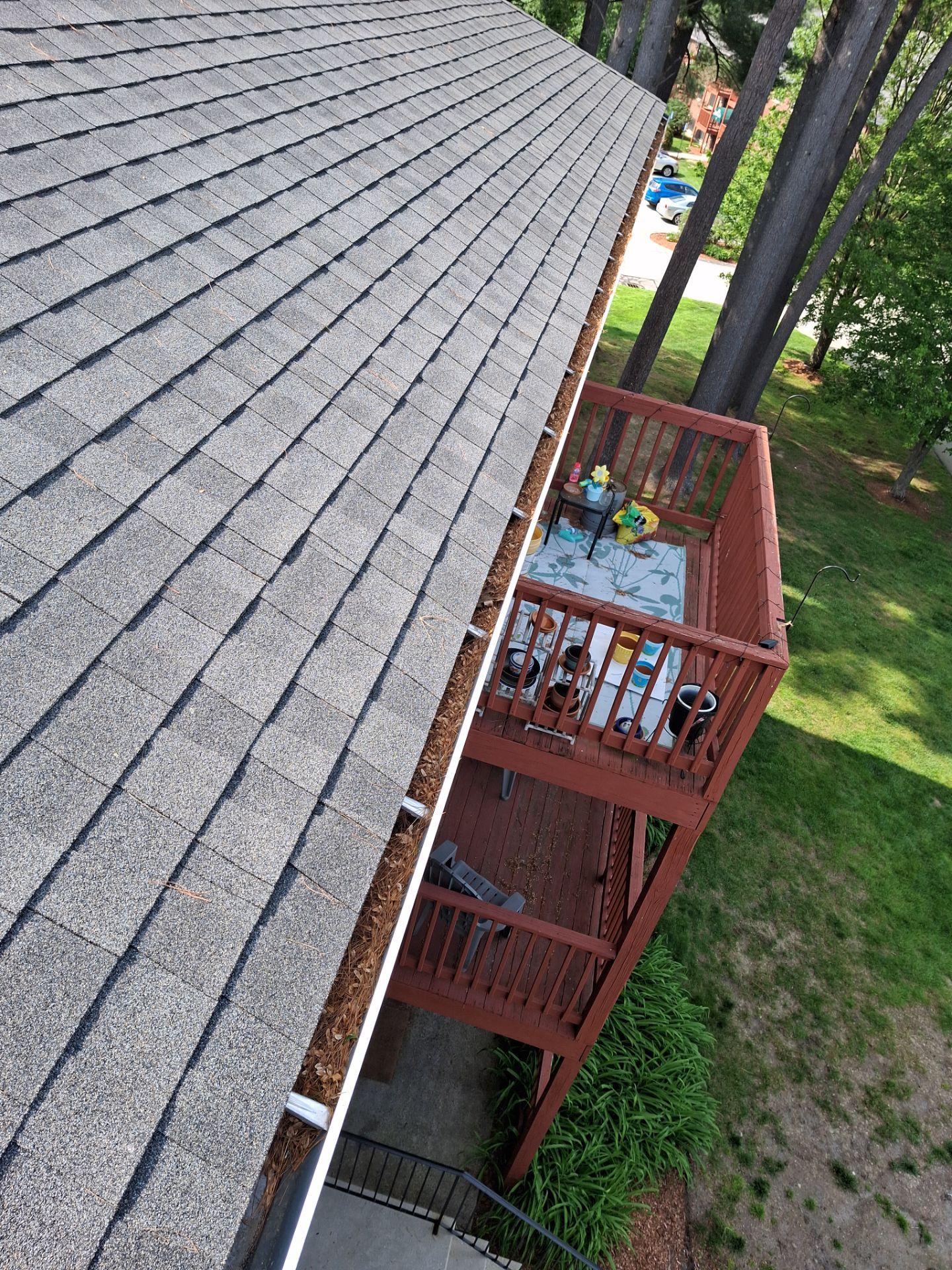 Commercial gutter cleaning New Hampshire before photo with filled gutters