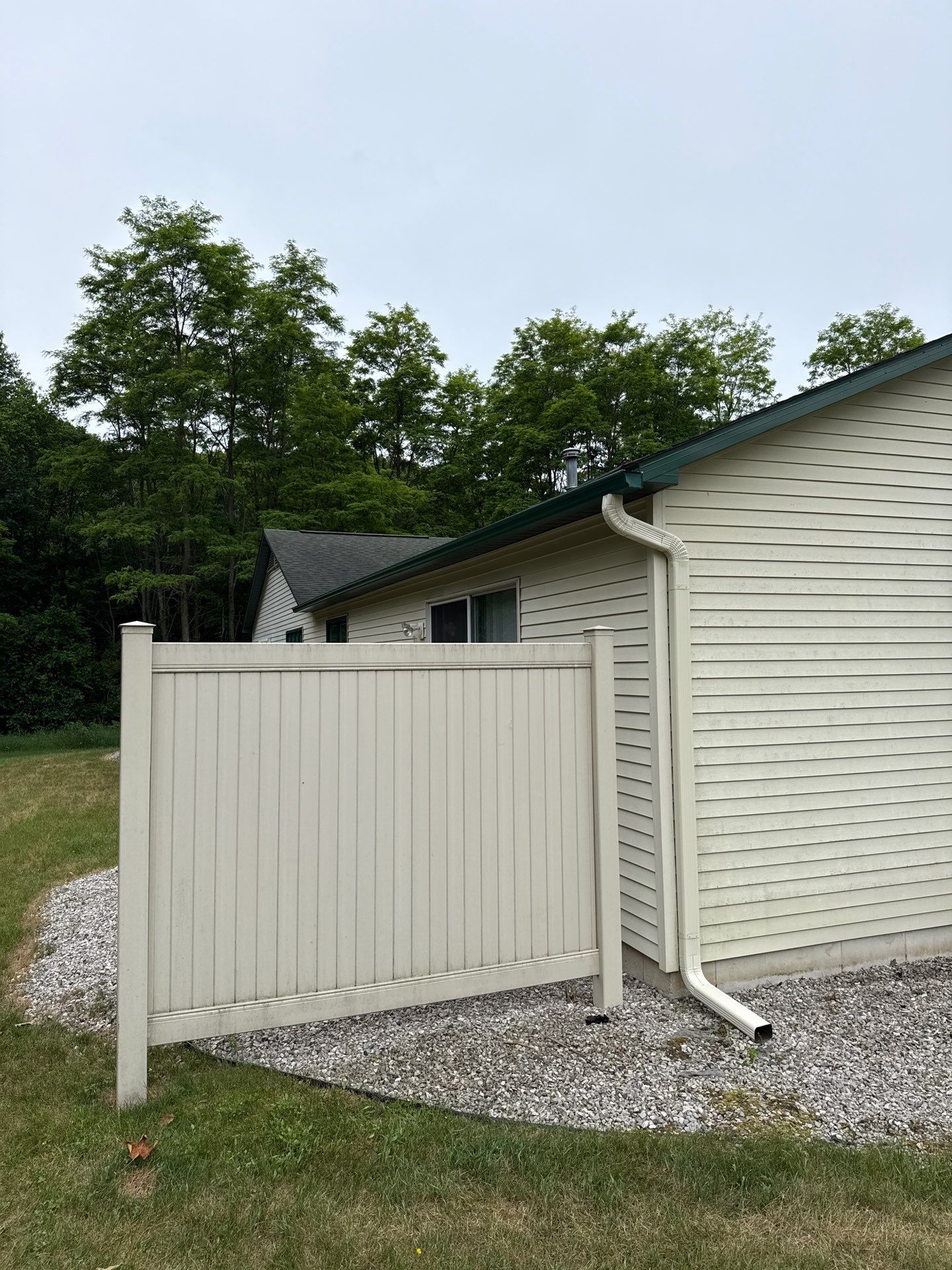Gutter and Downspout Installation for Residence and Detached Garage in Traverse City by Rainbow Seamless Systems