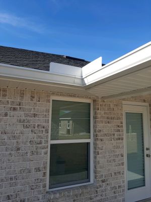 Seamless Gutter Installation Using White K-Style Gutters