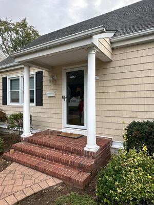 Gutter Installation using 5"white K style seamless gutters and 2x3 white leaders
