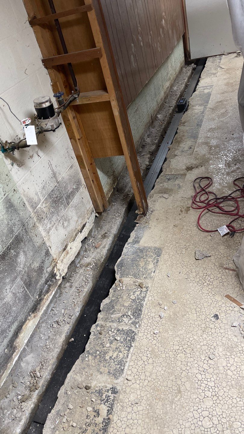 Interior Waterproofing Using GrateDrain™ Products by Toledo Basement Repair 