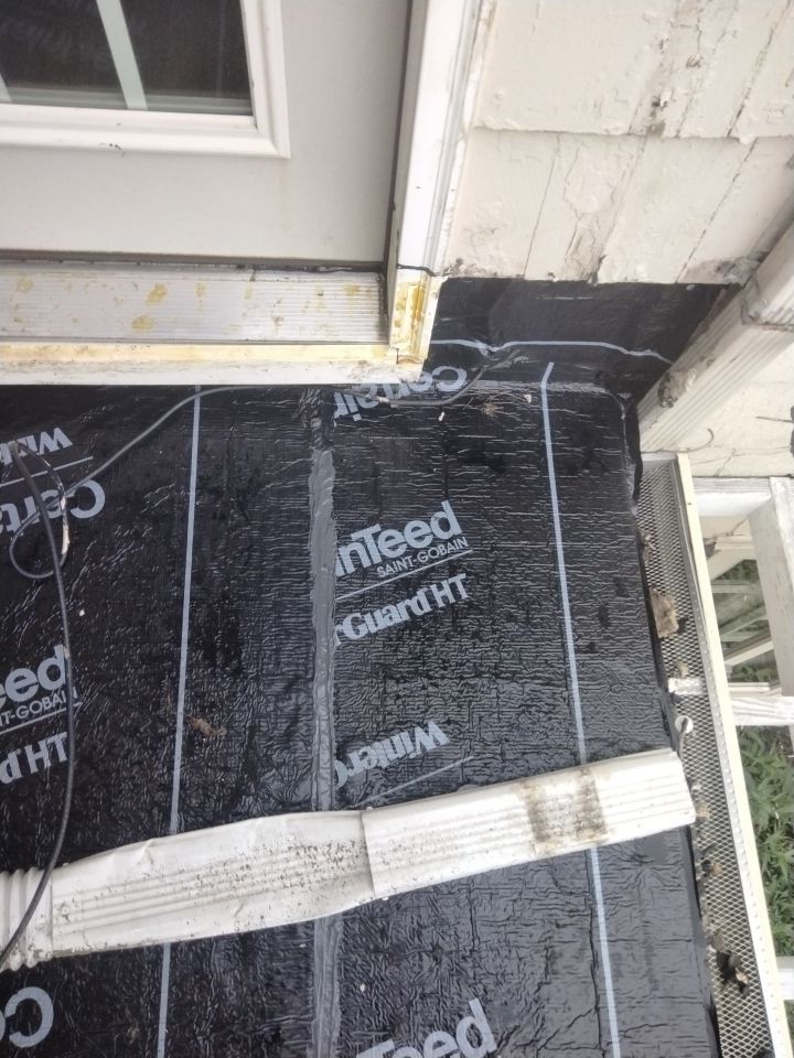 Residential Roofing Installation, Dec-tek walk-out porch roof, siding on garage by Absolute Roofing and Construction