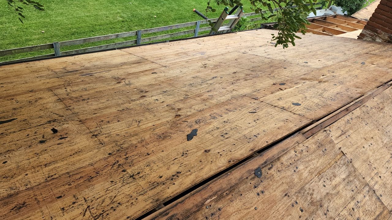 Residential Roofing Installation using 60 mil rubber roof  by Nitro Roofing and Construction
