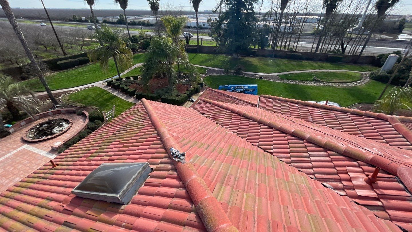 Tile refurbish project using existing tiles and replaced underlayment and battens by Straight Edge Roofing Inc