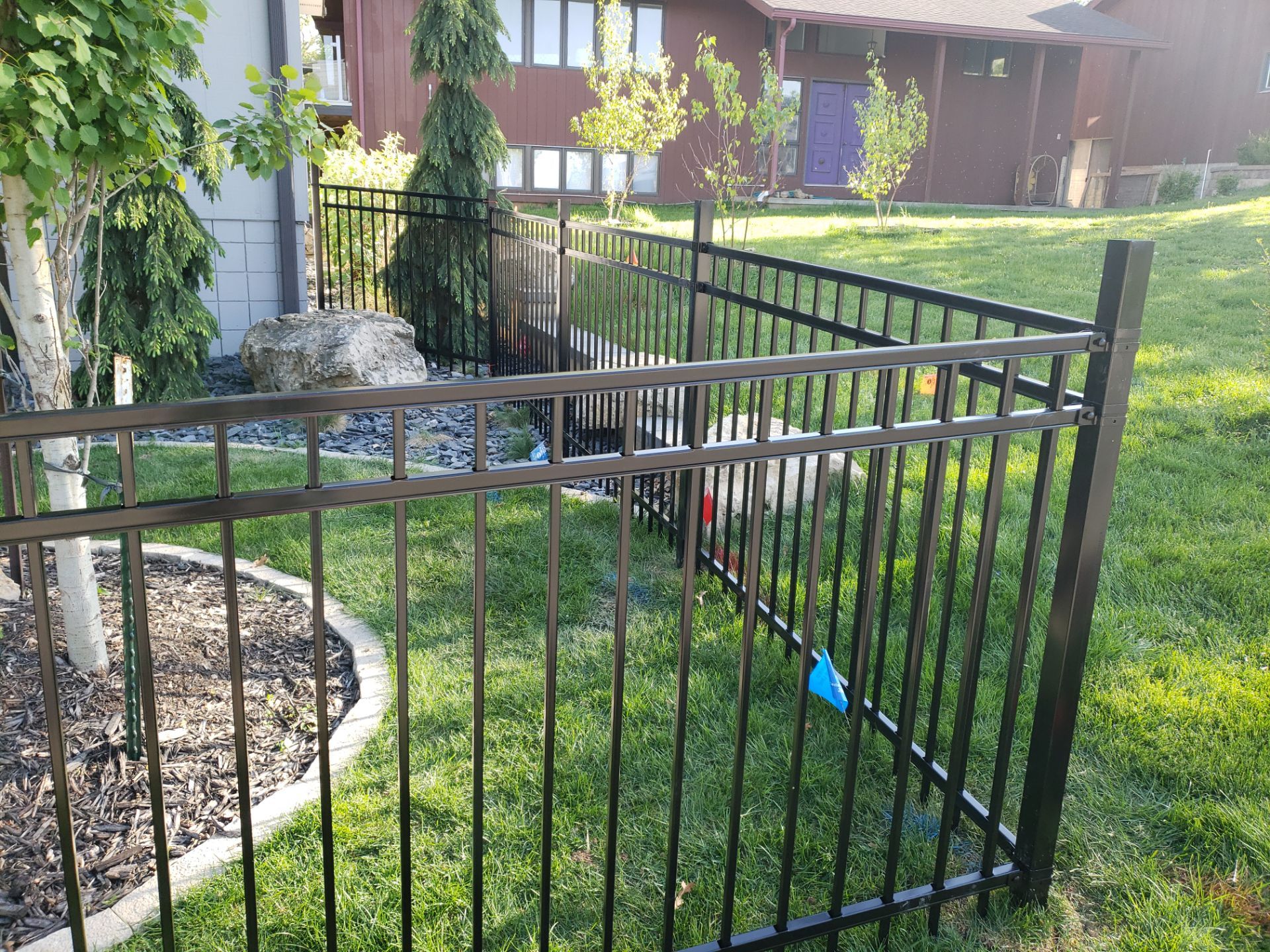 Ornamental Black Metal Picket Fence Installation in Cedar Falls by Perfect Picket Fence and Stain