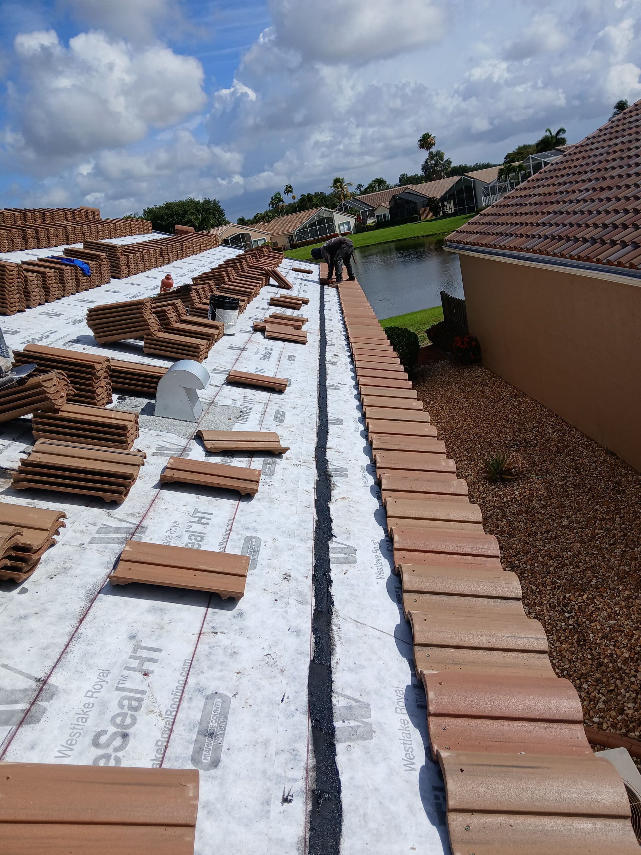 New Barrel Tile Roof Installation and Decking Repair in Boynton Beach by Aastro Roofing