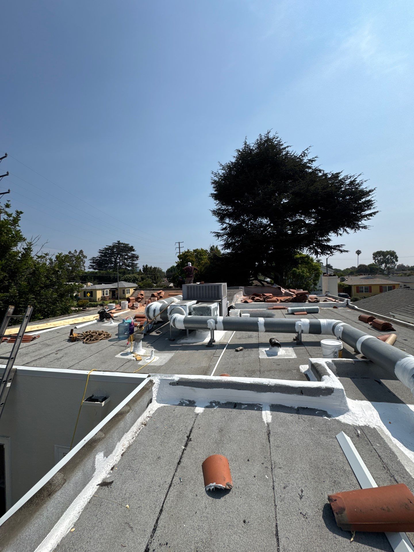 Tile Reset and Silicone Membrane Installation by Hull Brothers Roofing