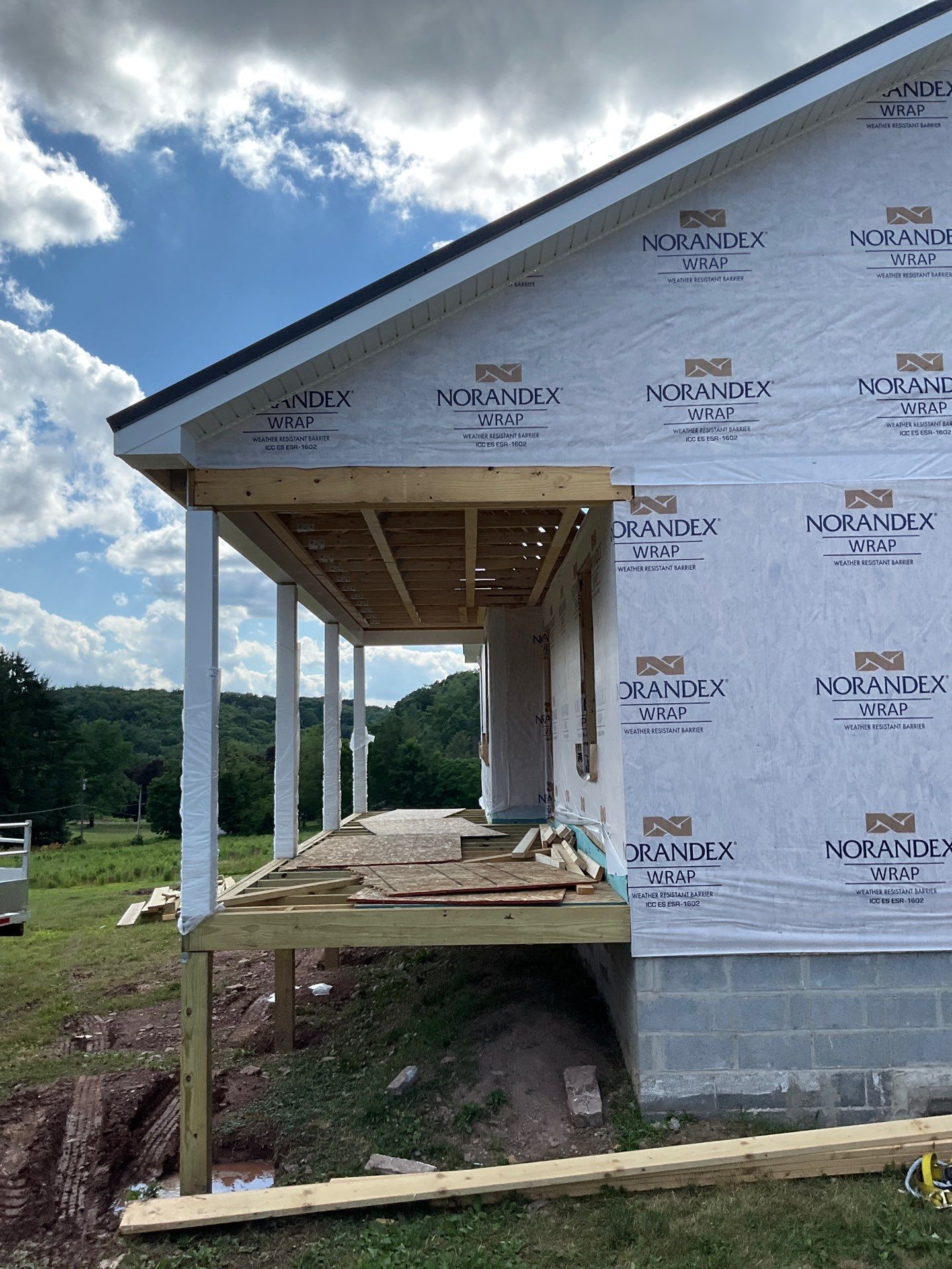 New Residential Addition with Blue Siding and Metal Roofing in Ashland by Esh Builders