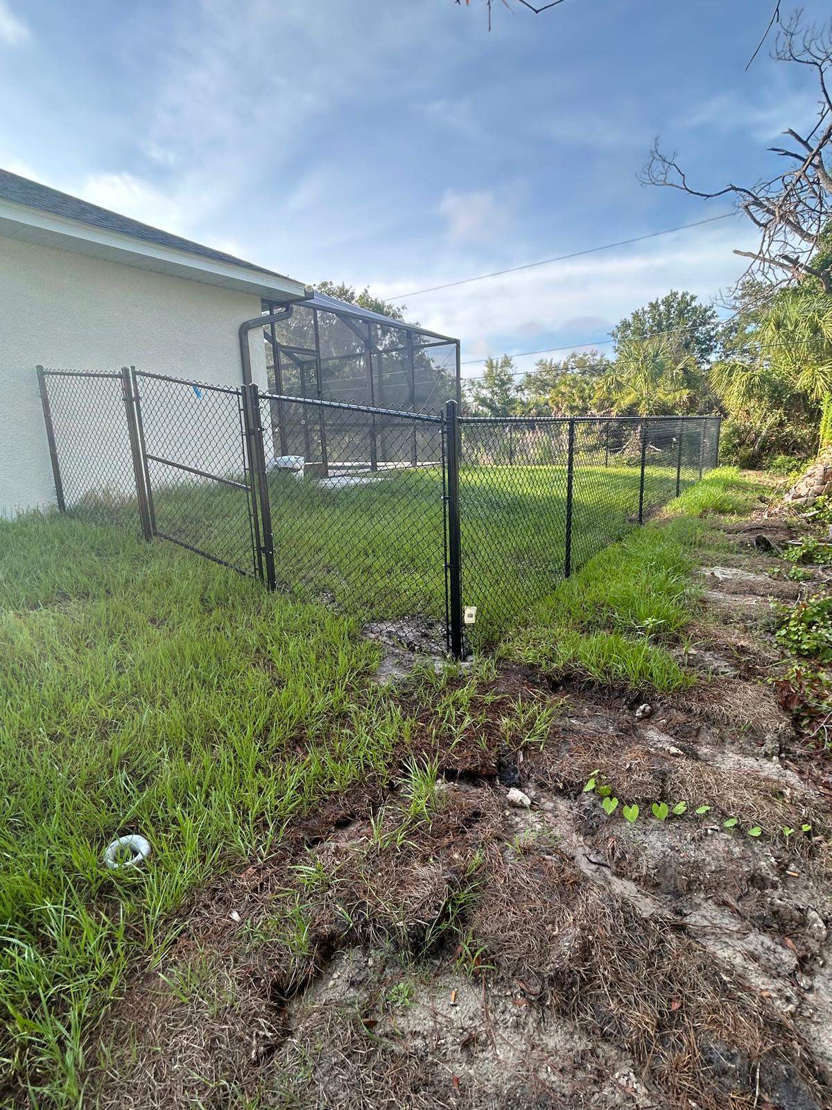 Residential Black Vinyl-Coated Chain Link Fence in Port Charlotte by True Fence LLC
