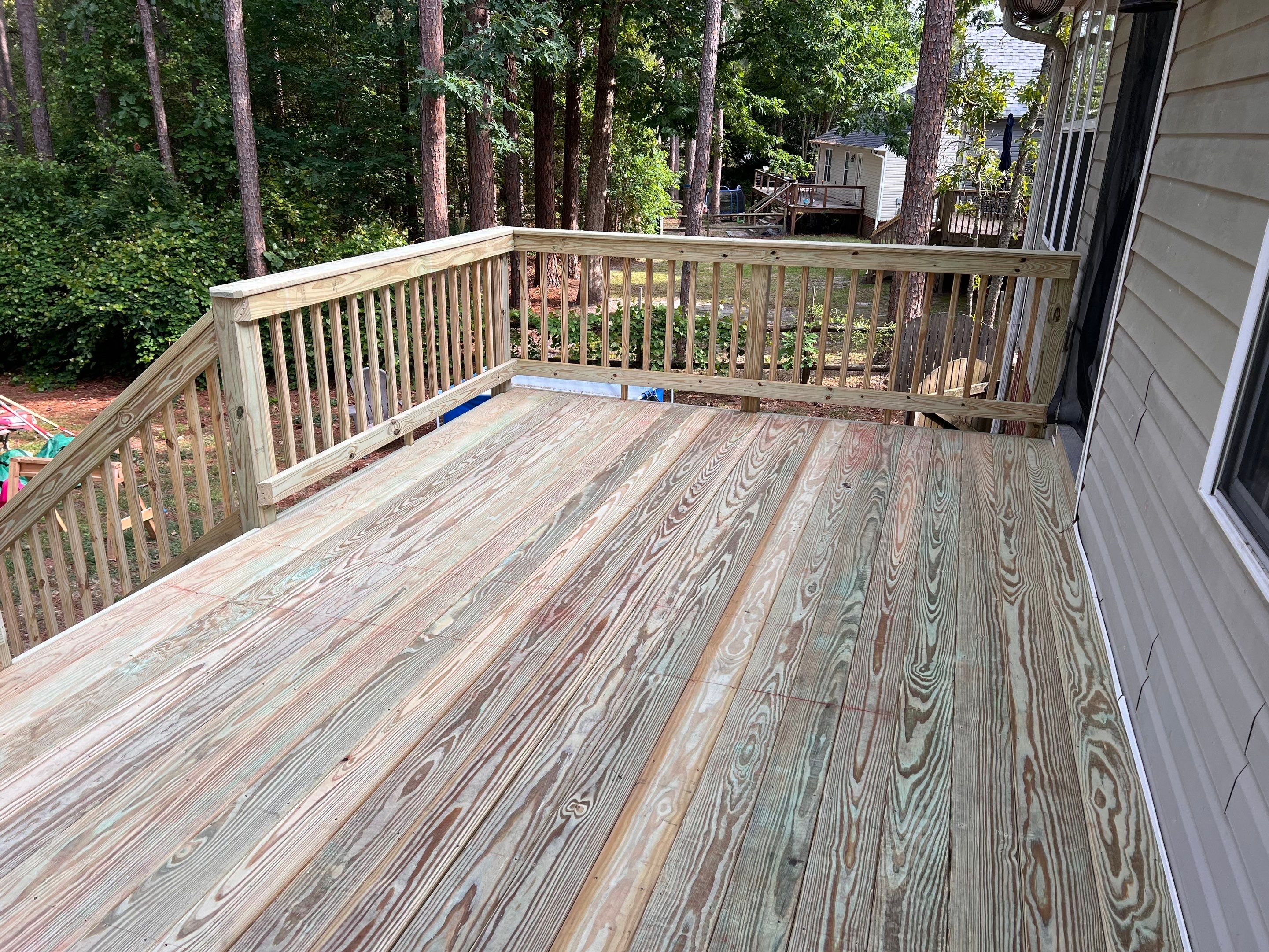 Pressure-Treated Wood Deck Resurface and Stair Replacement in Sanford by The Remodeling Company