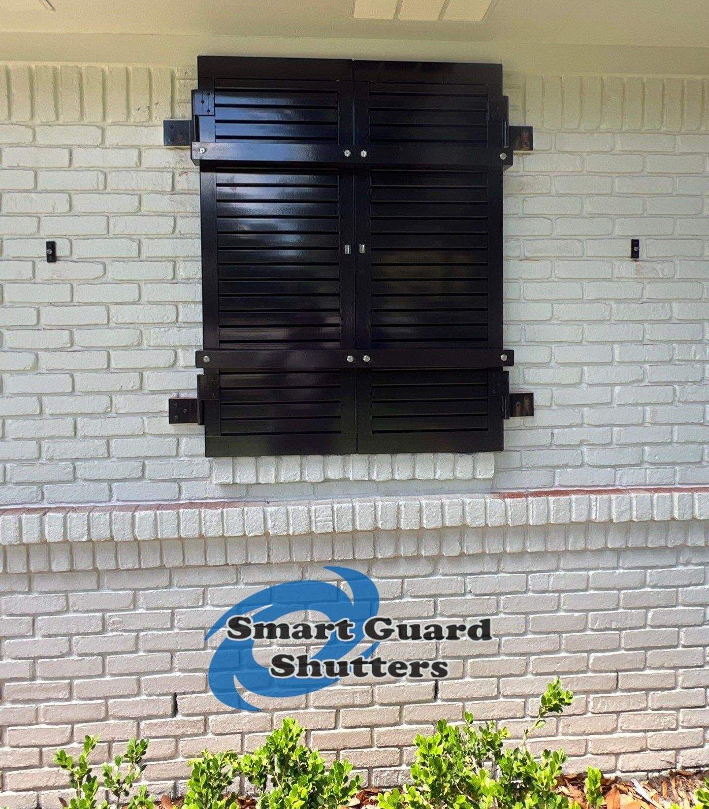 Impact Colonial & Bahama Shutters in Jet Black by Smart Guard Shutters