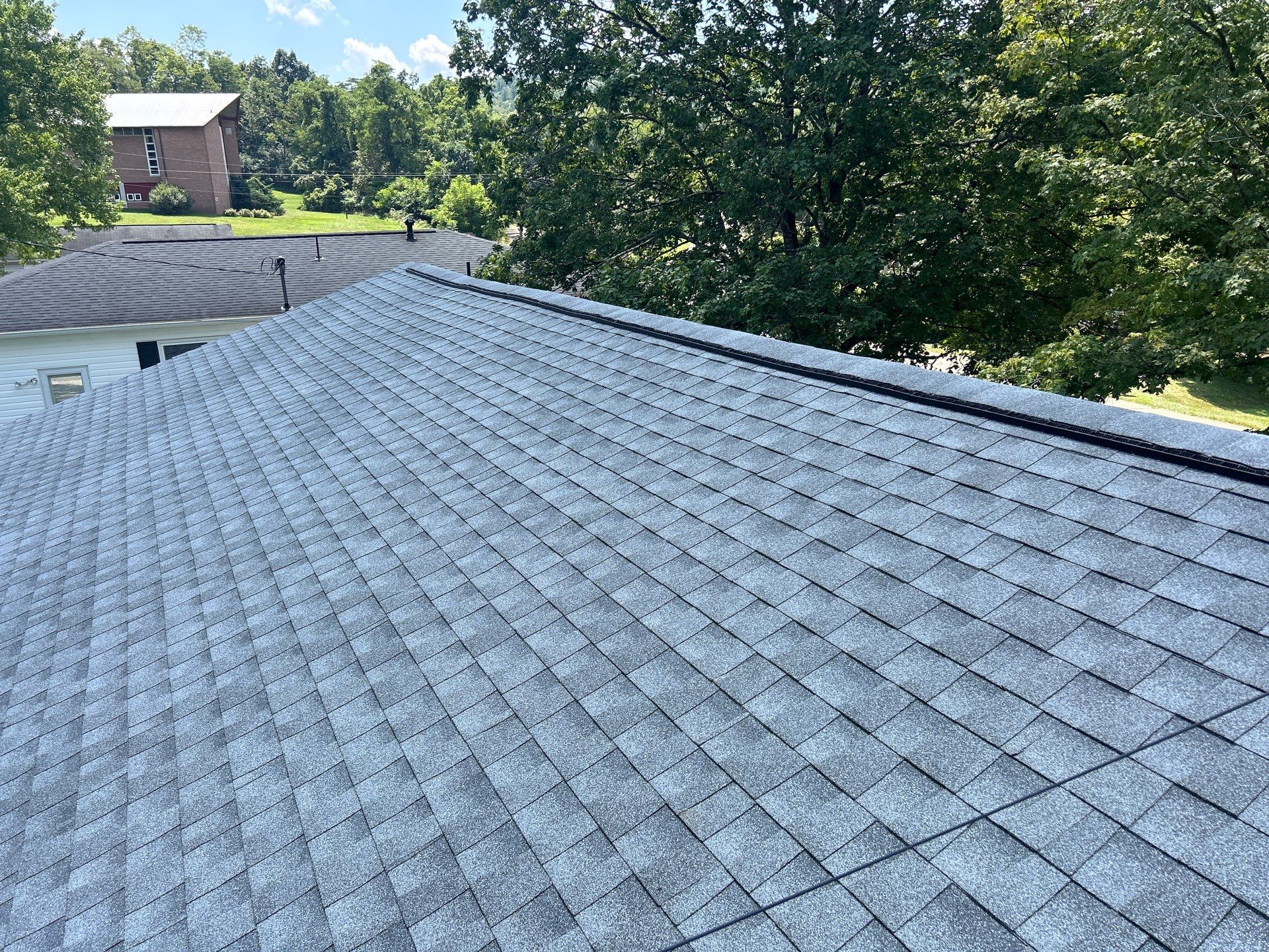 Residential Roofing Installation using GAF Timberline HDZ Oyster Grey by Rainstoppers Roofing