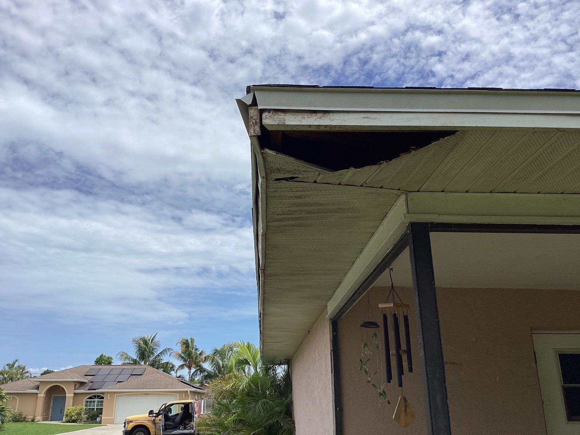 Replace gutter using White Down Spouts in Cape Coral FL by Gutter Professors