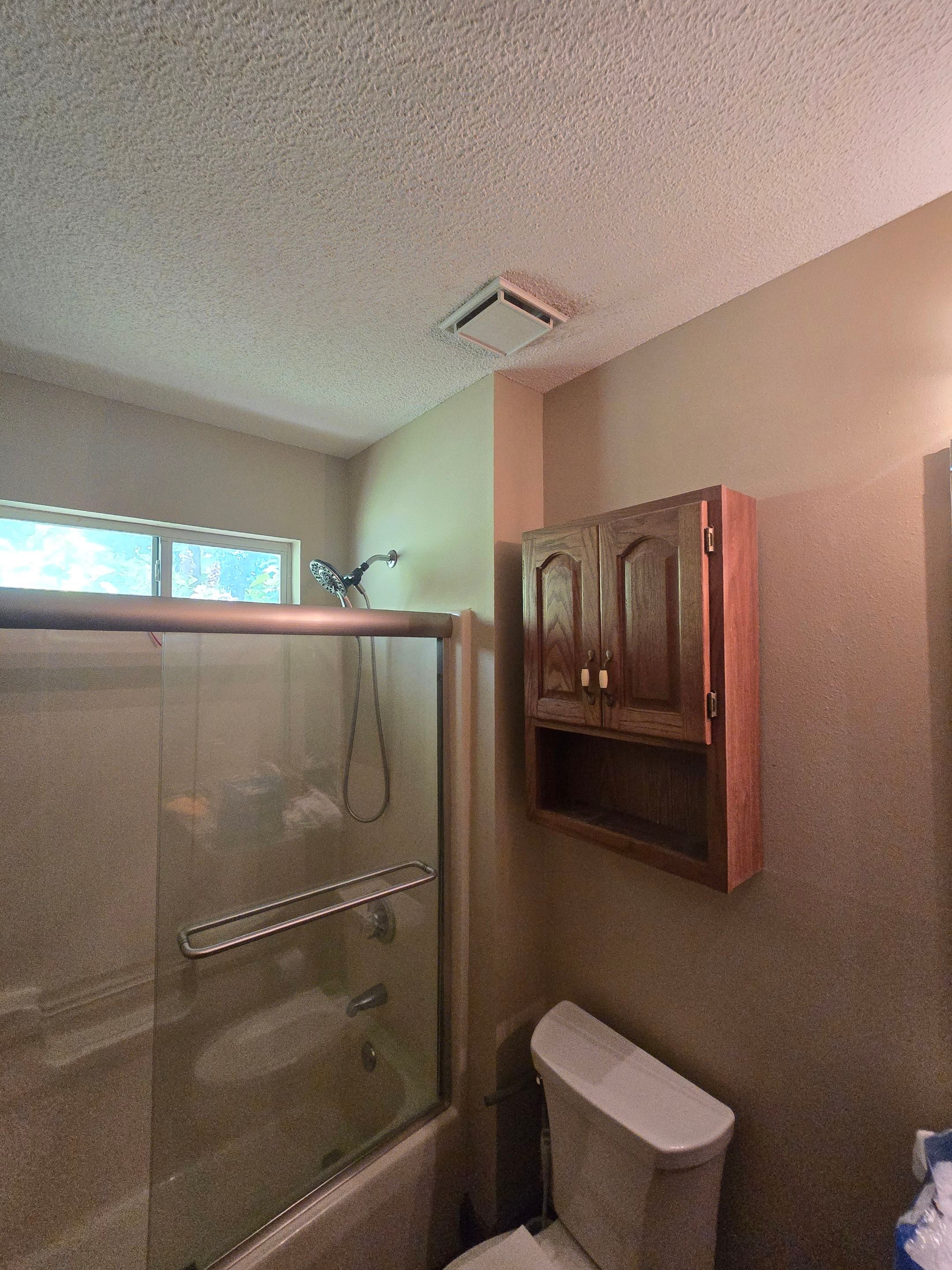 Sentrel Shower with window and ADA chair / ADA grab bar by Academy Construction